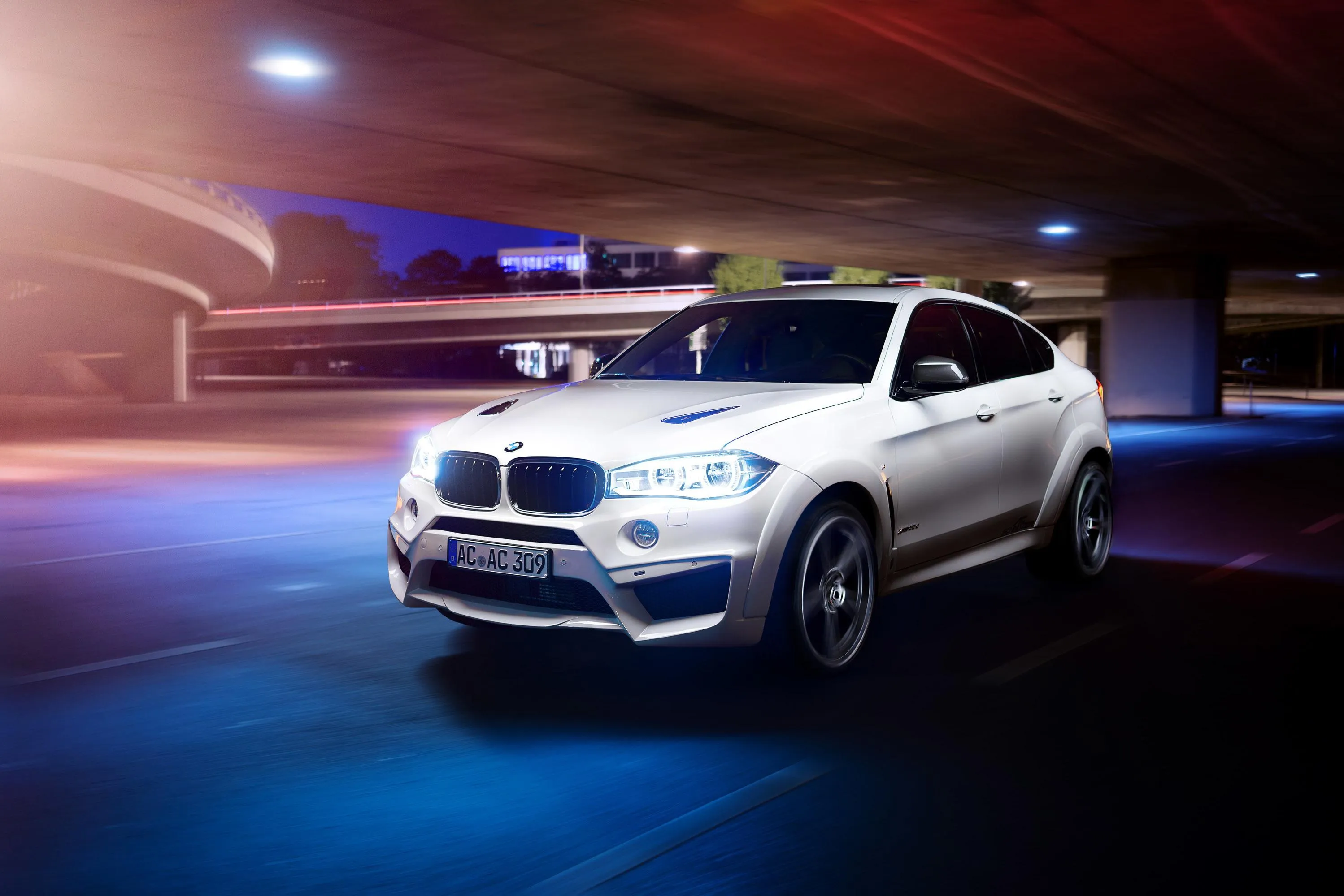 White Bmw Suv Driving Fast in Blue Neon Light Parking Garage