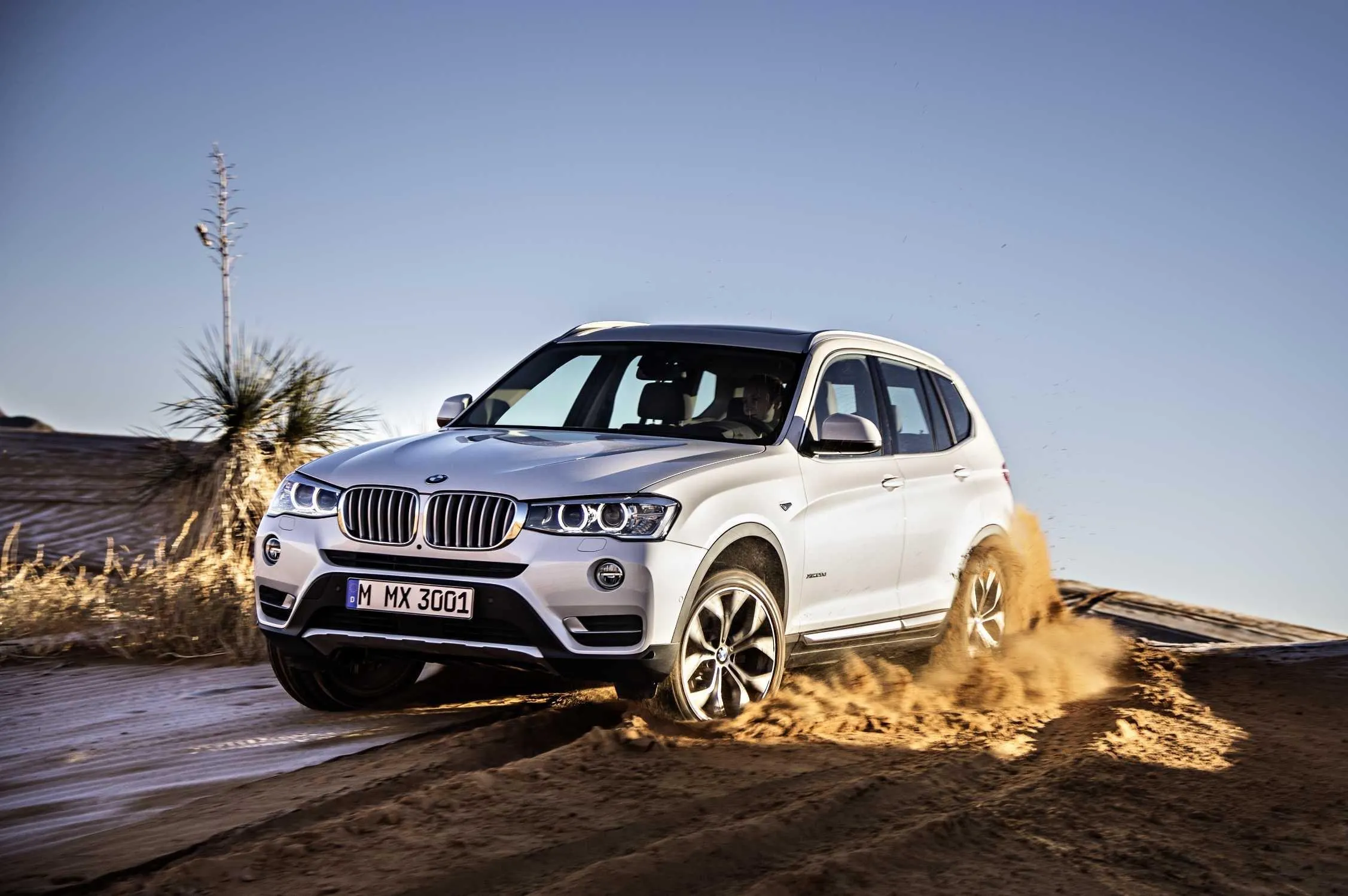 White Bmw Suv Driving Fast in Sand Dune Offroad Area