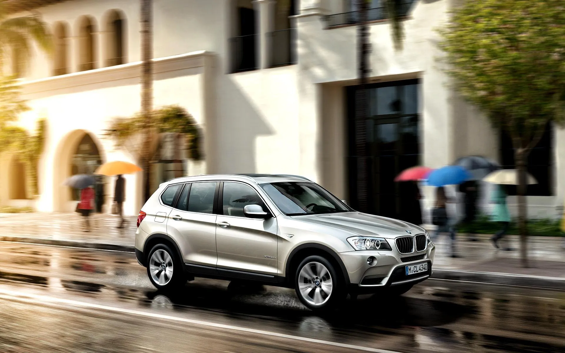 White Bmw Suv Driving Through Rainy City Street View