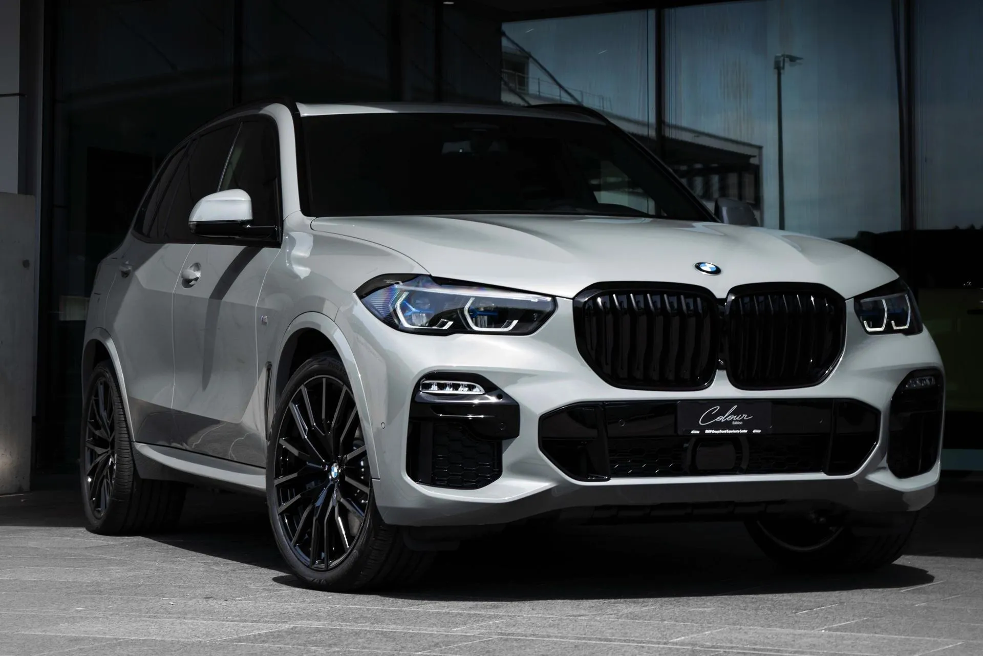 White Bmw Suv Parked in Front of Glass Building Wallpaper
