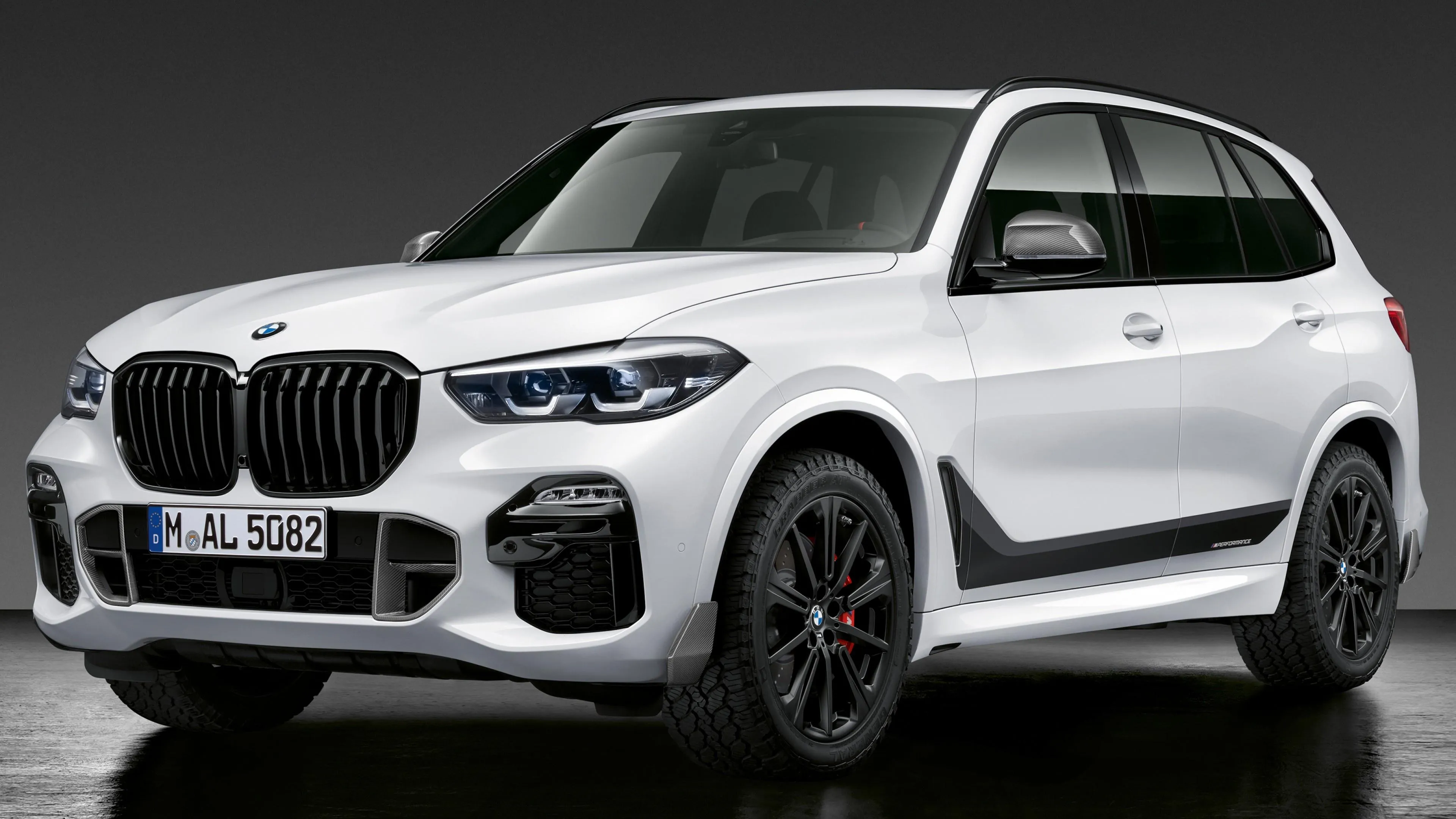 White Bmw Suv Parked Near Forest with Black Wheels