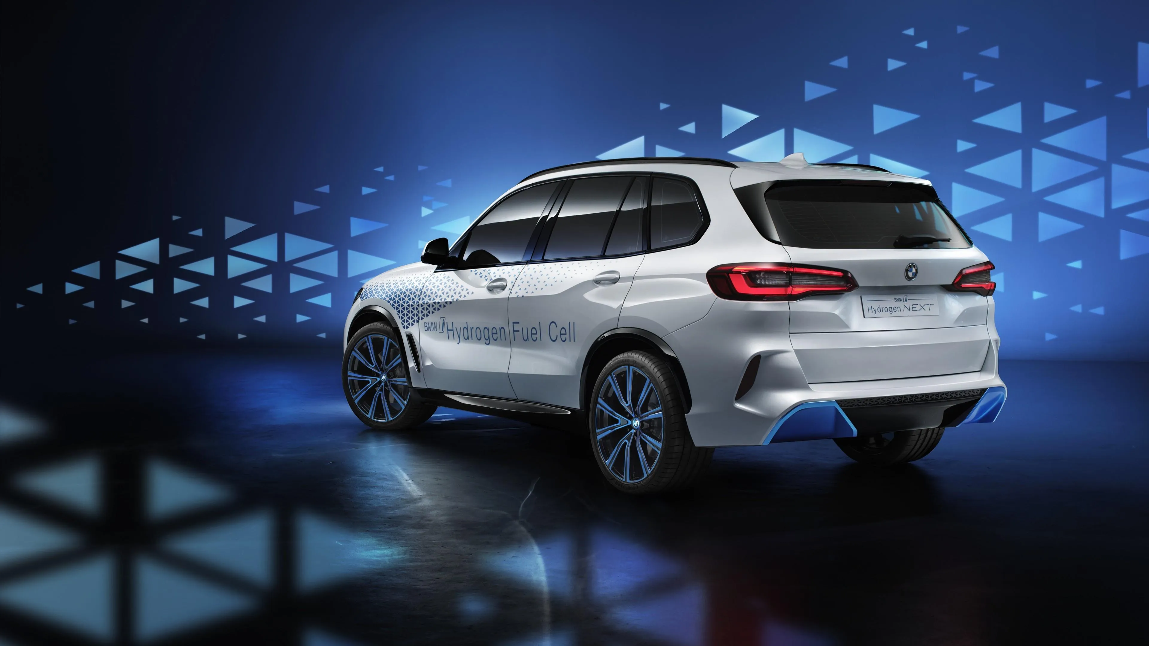 White Bmw Suv Showcased in Futuristic Blue Light Environment