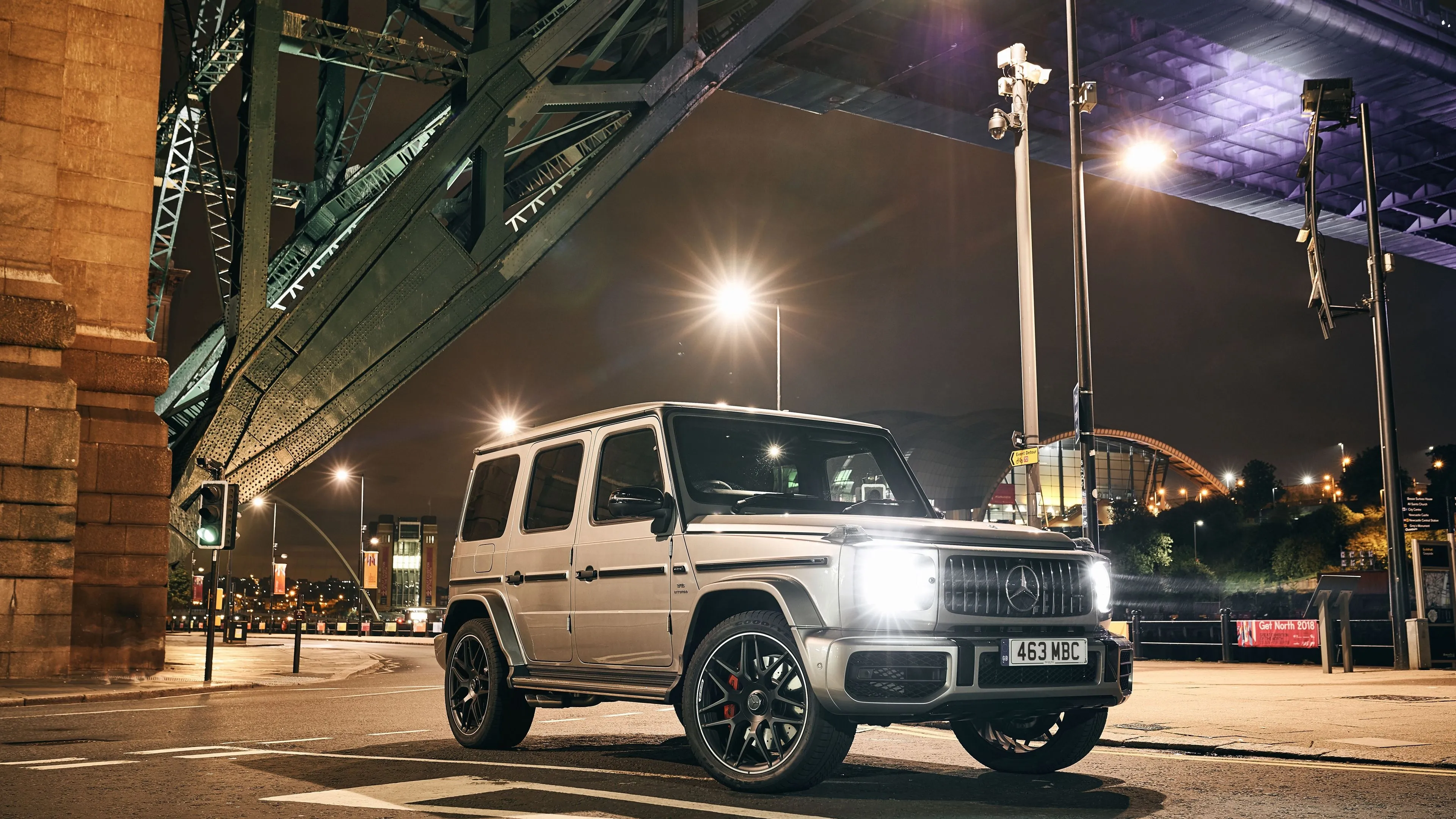 White G Class Mercedes Displayed Under City Bridge Lights