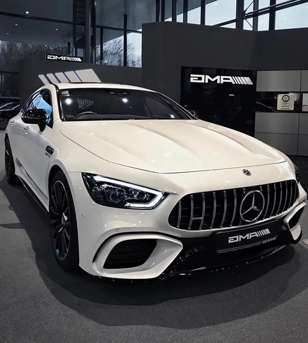 White Mercedes AMG Displayed Inside Luxury Car Showroom