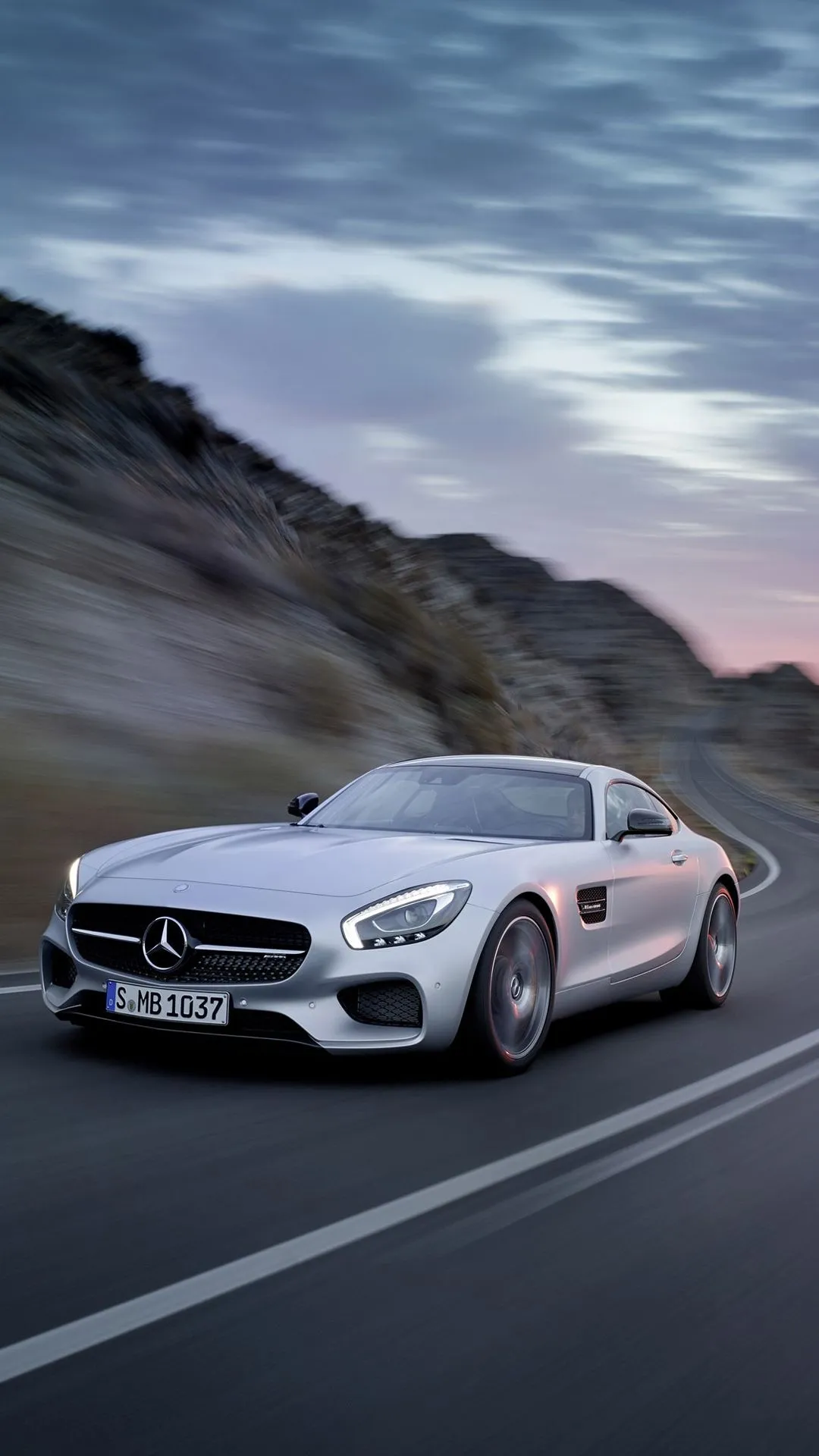 White Mercedes Benz AMG Coupe Driving on Mountain Road