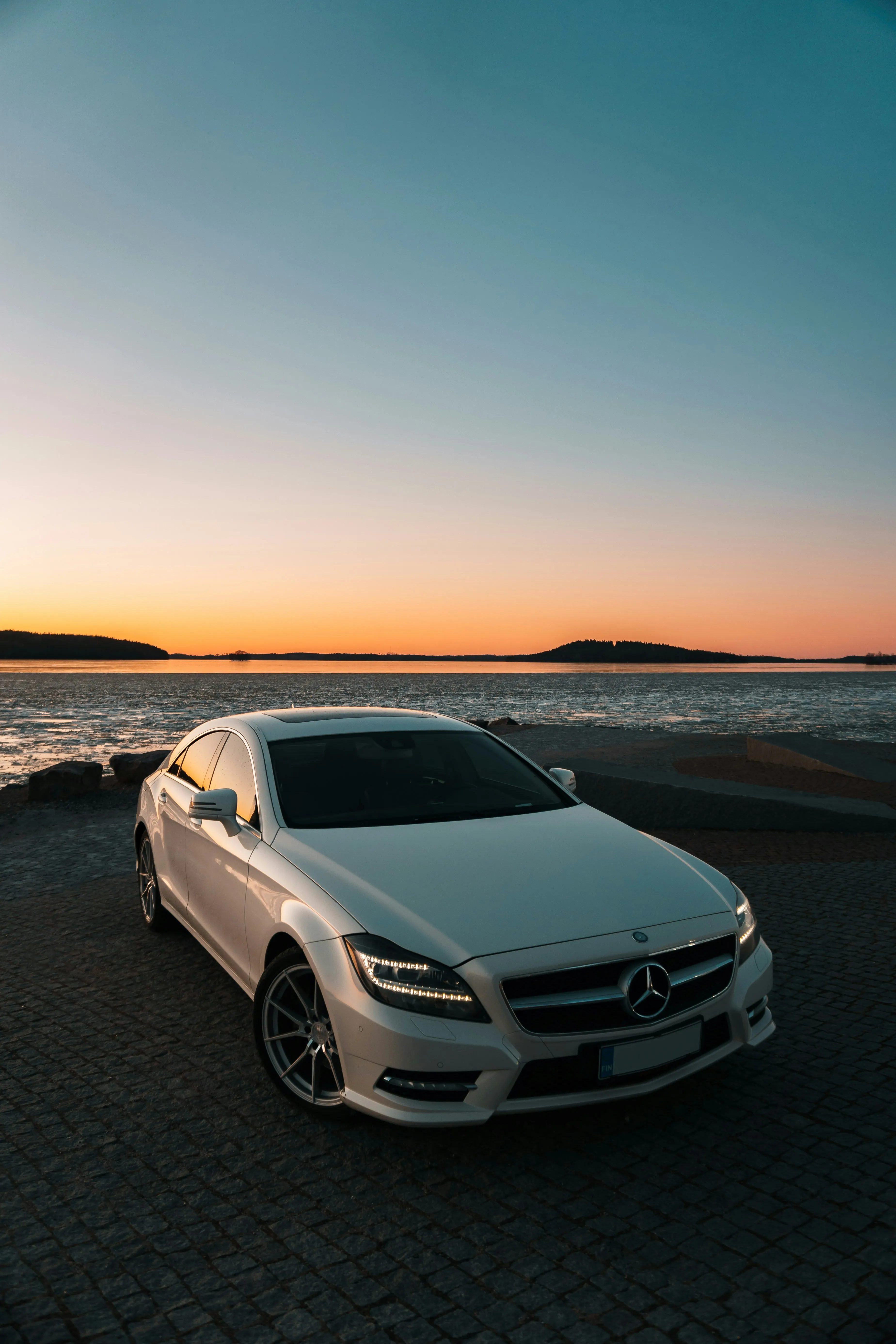 White Mercedes Benz Car at Sunset Near Water Wallpaper