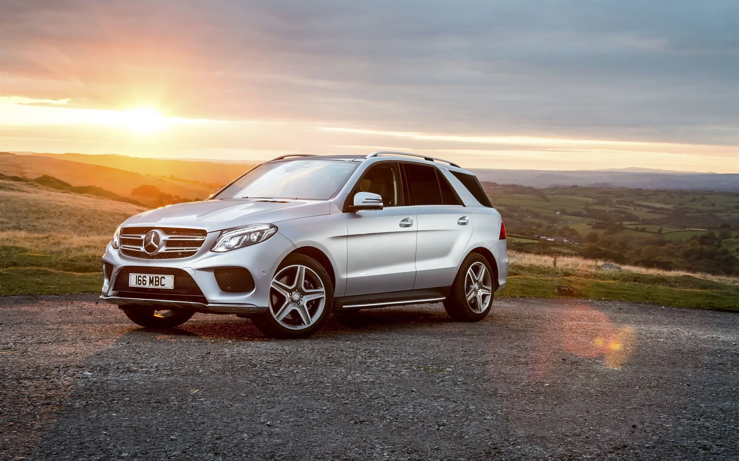 White Mercedes Benz Compact SUV at Sunset on Countryside Road
