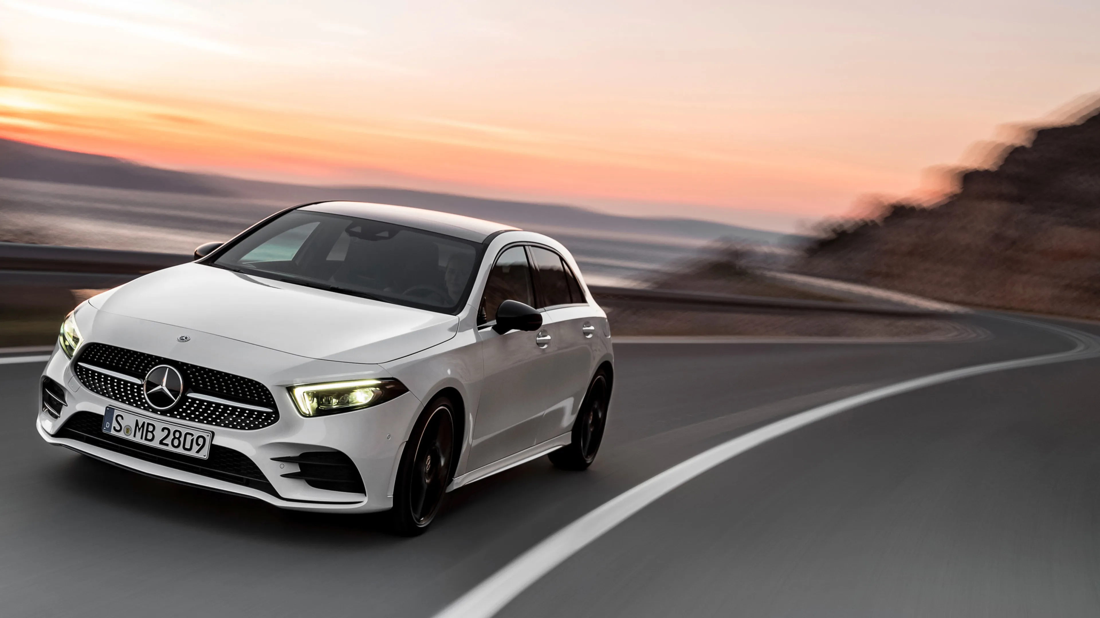White Mercedes Benz Compact SUV Driving on Curvy Road