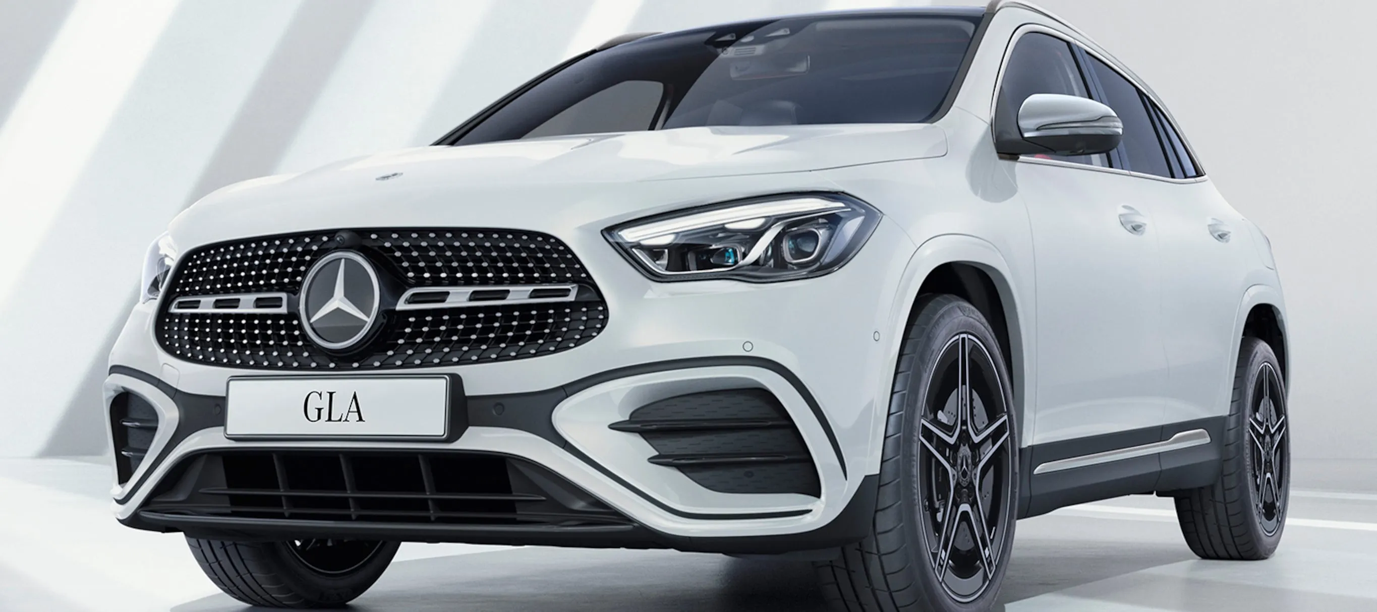 White Mercedes Benz Compact SUV in Bright Studio Lighting