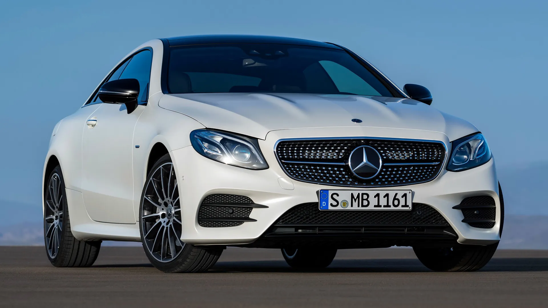 White Mercedes Benz Coupe Parked on Clean Asphalt Road