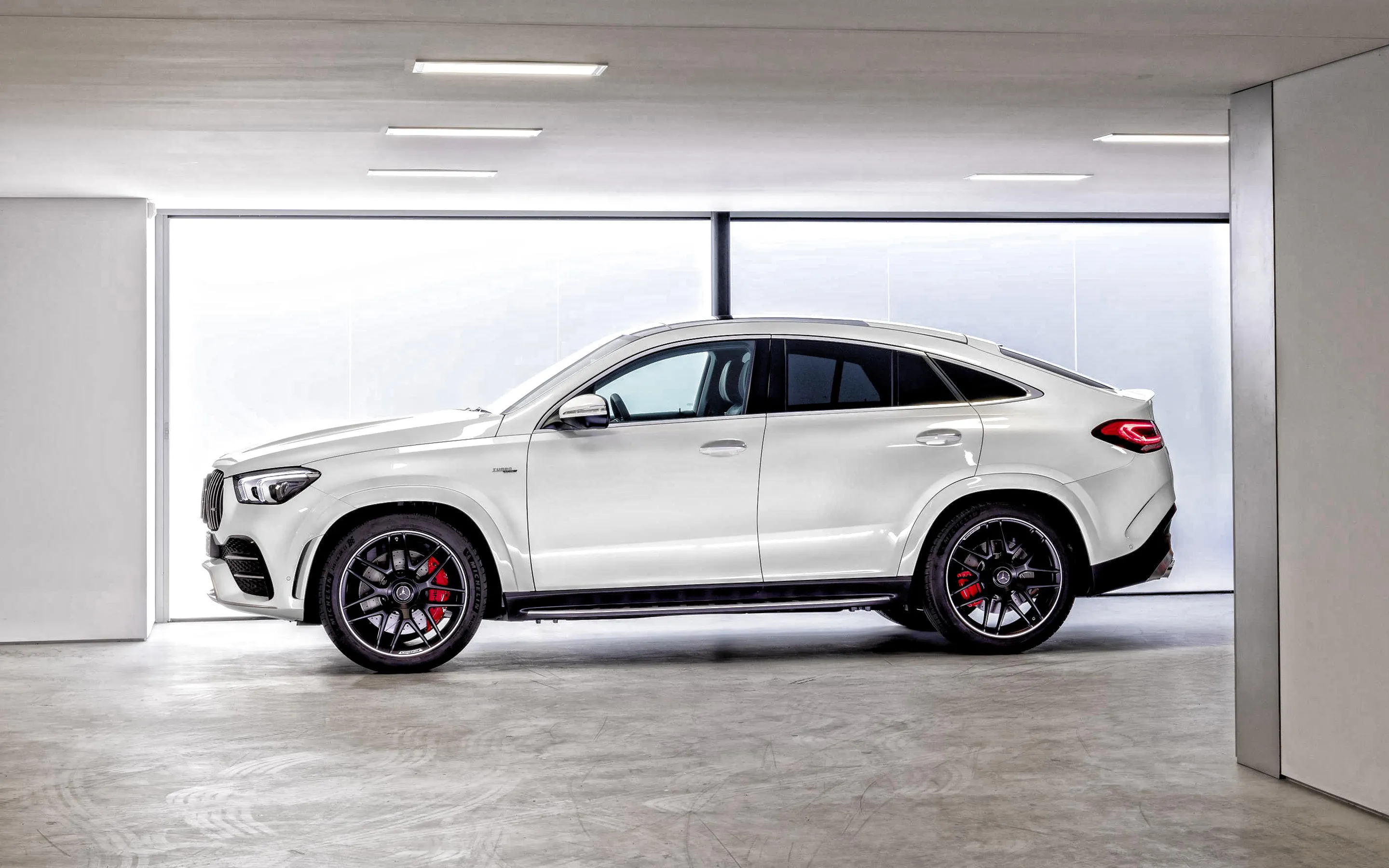 White Mercedes Benz Coupe SUV in Indoor Garage Display