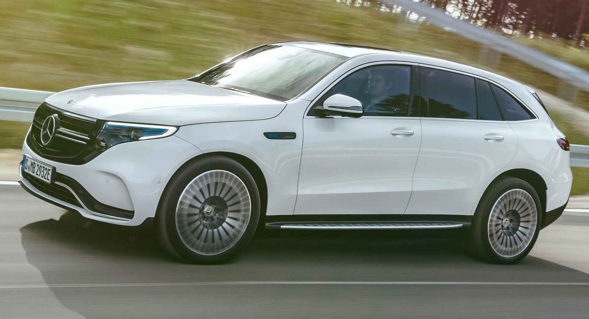 White Mercedes Benz Electric SUV Driving on Highway