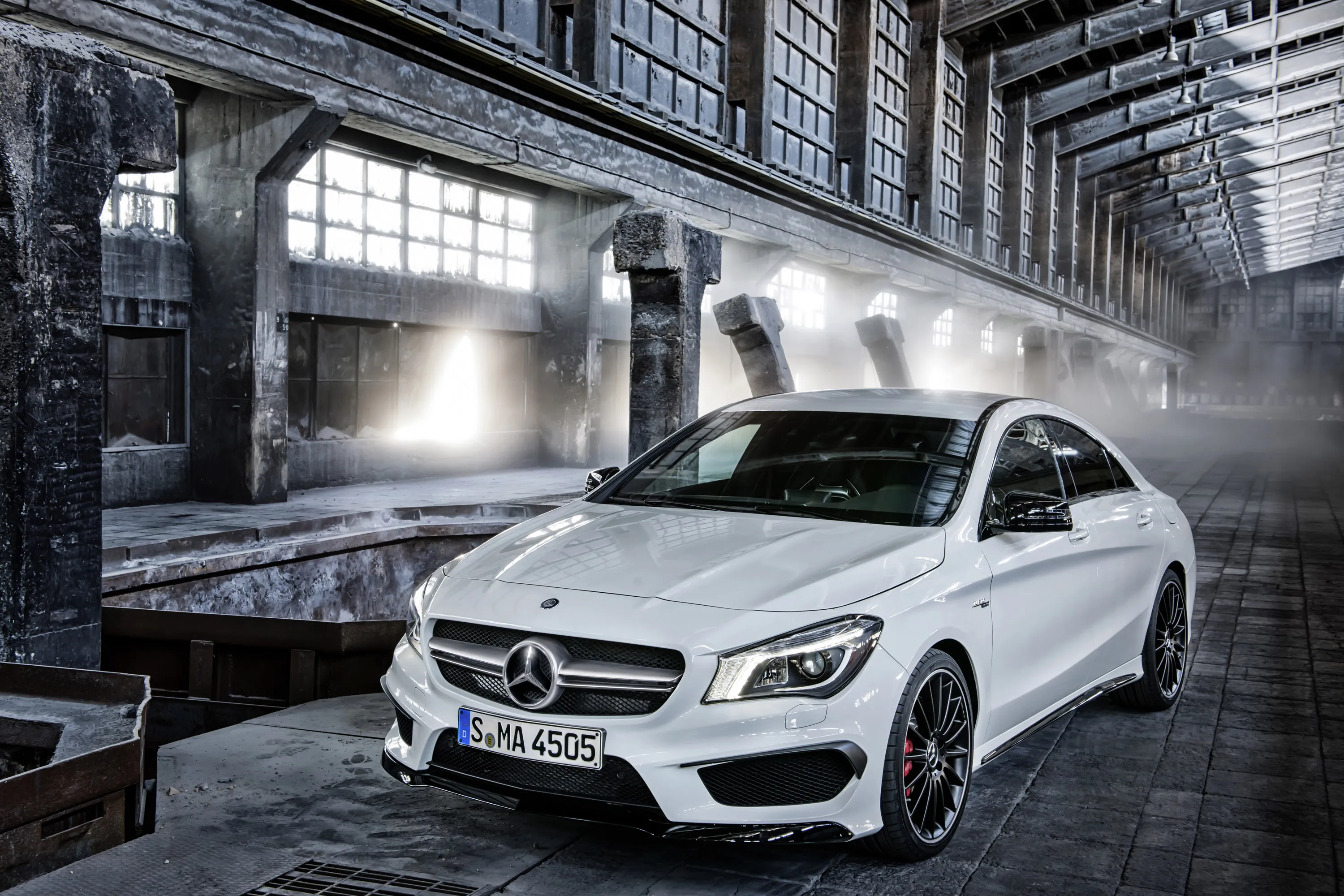 White Mercedes Benz Hatchback Parked in Industrial Area