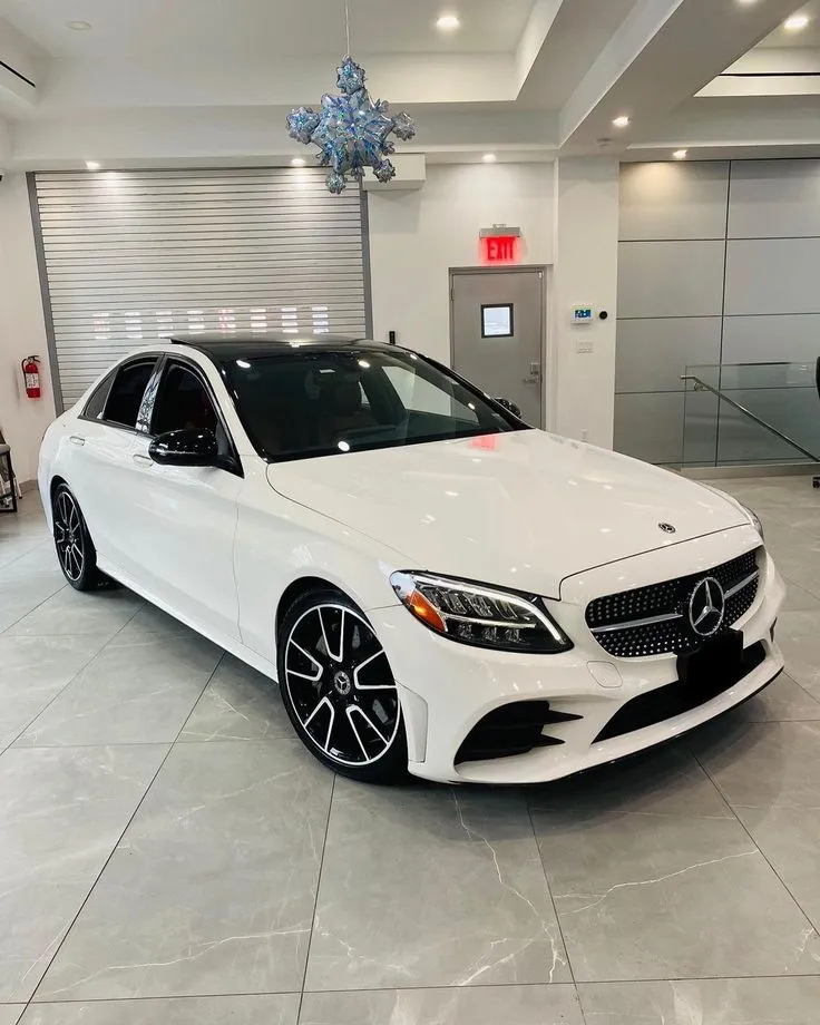 White Mercedes Benz in Showroom with Christmas Decor