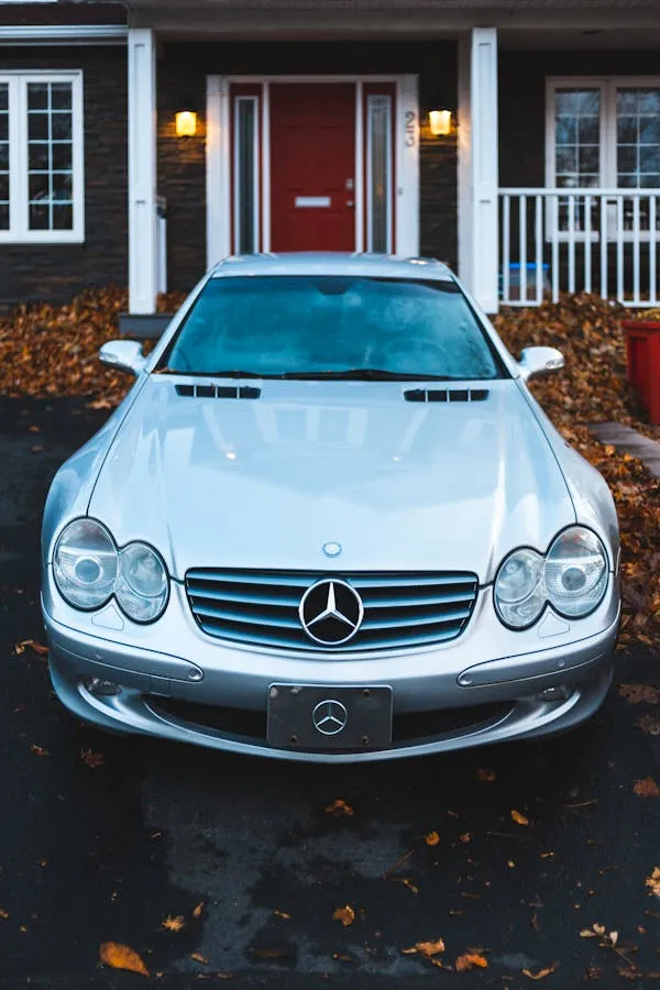 White Mercedes Benz SL Class in Suburban Driveway image