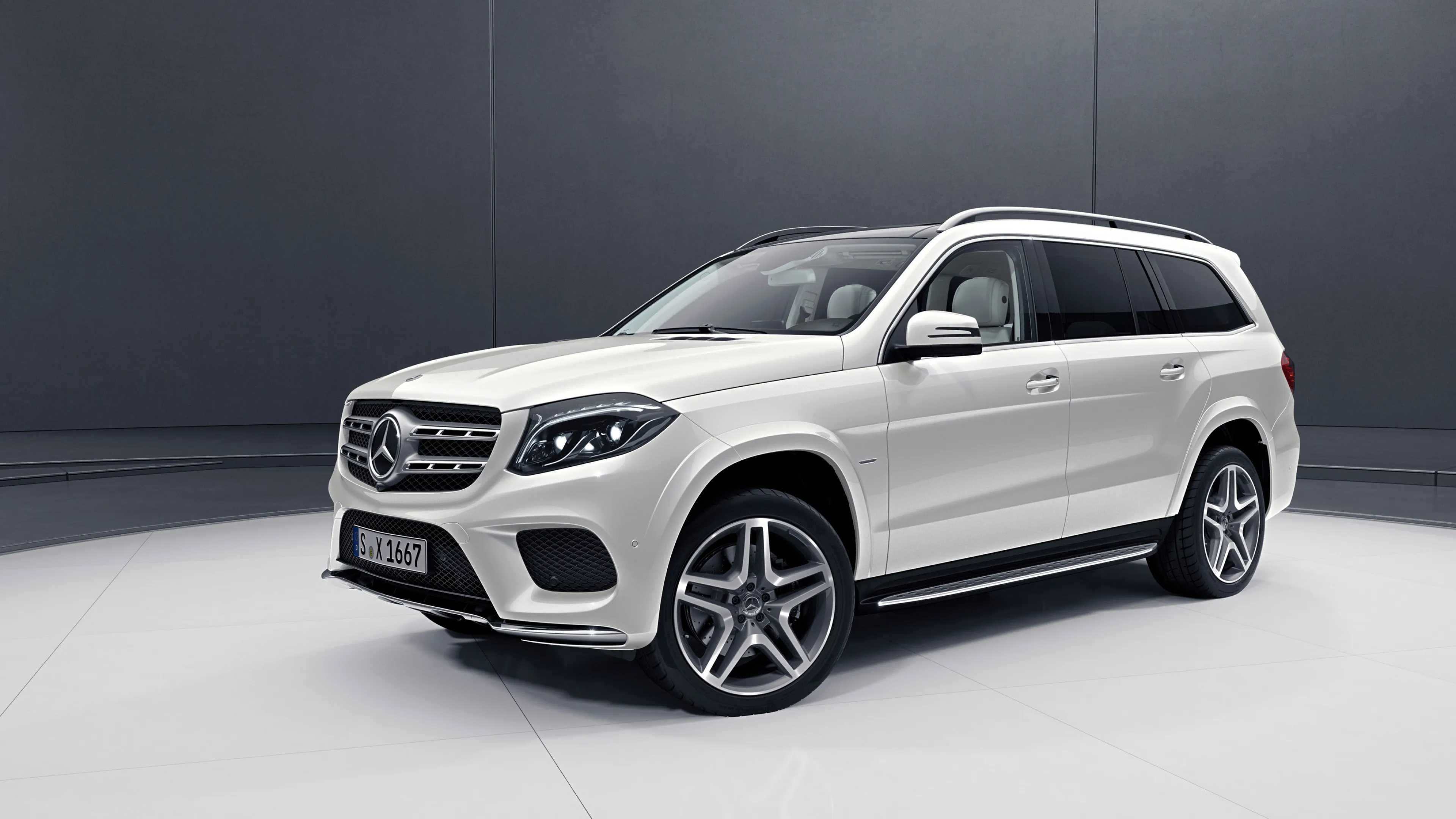 White Mercedes Benz Spacious SUV Displayed Indoors image