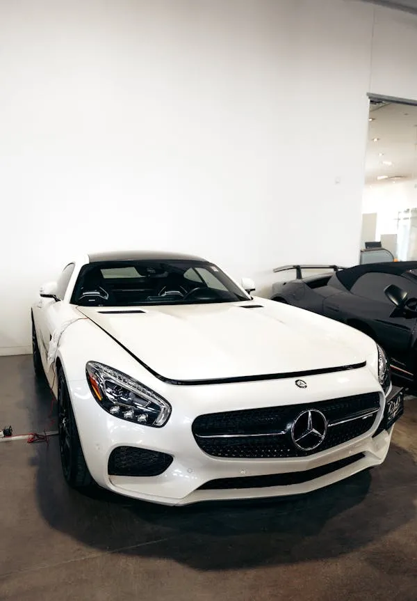 White Mercedes Benz Sports Car Inside Showroom free image