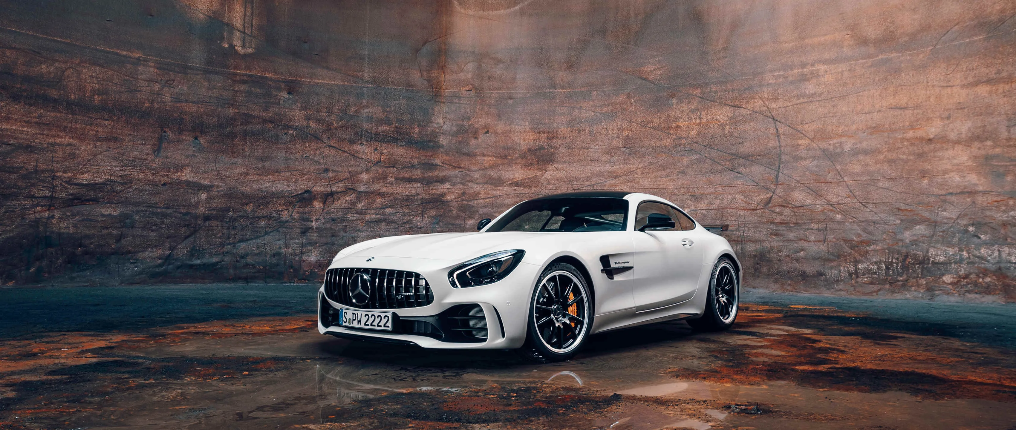 White Mercedes Benz Sports Car Parked in Rugged Canyon Environment