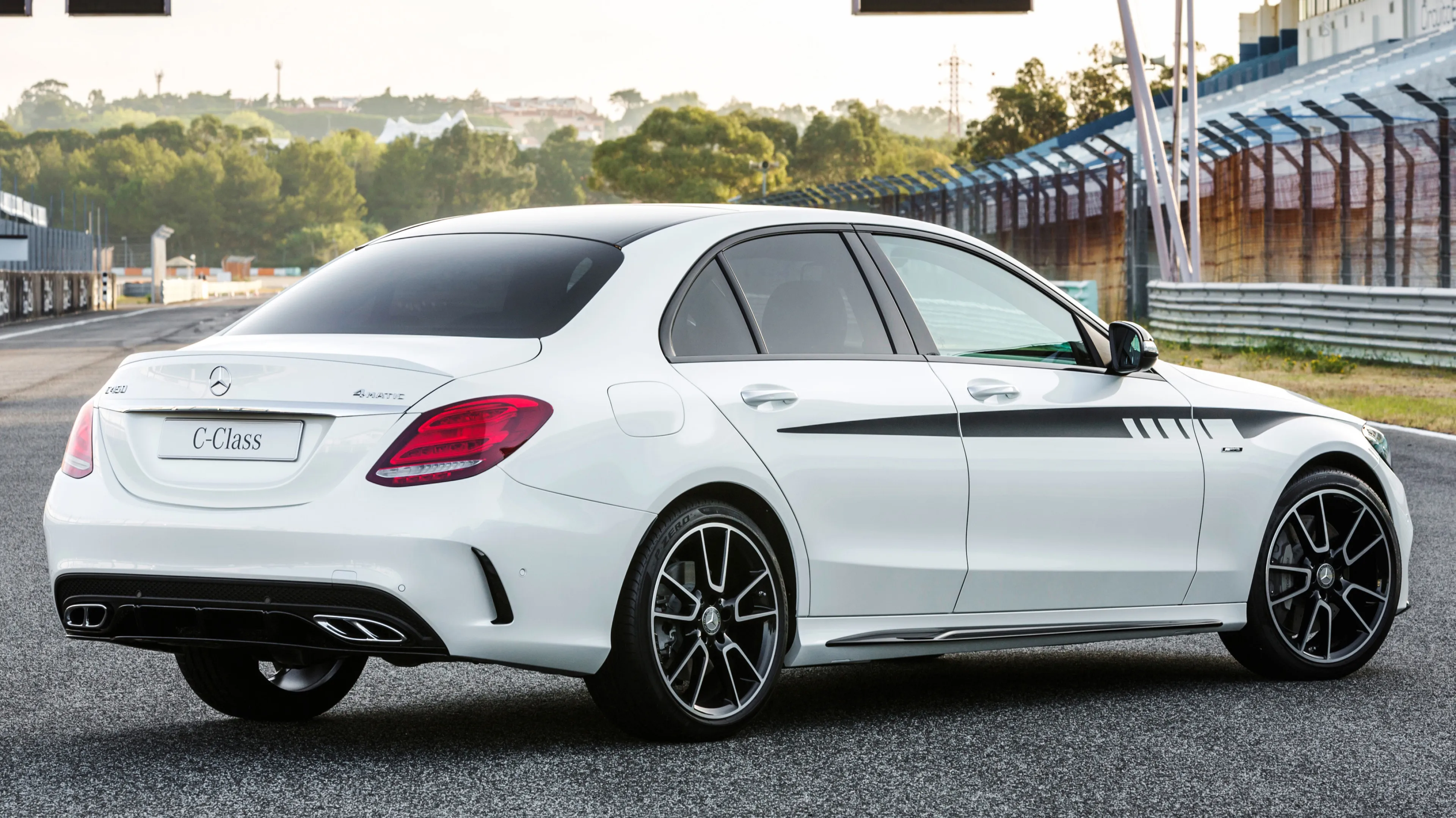 White Mercedes Benz Sports Sedan Parked on Race Track
