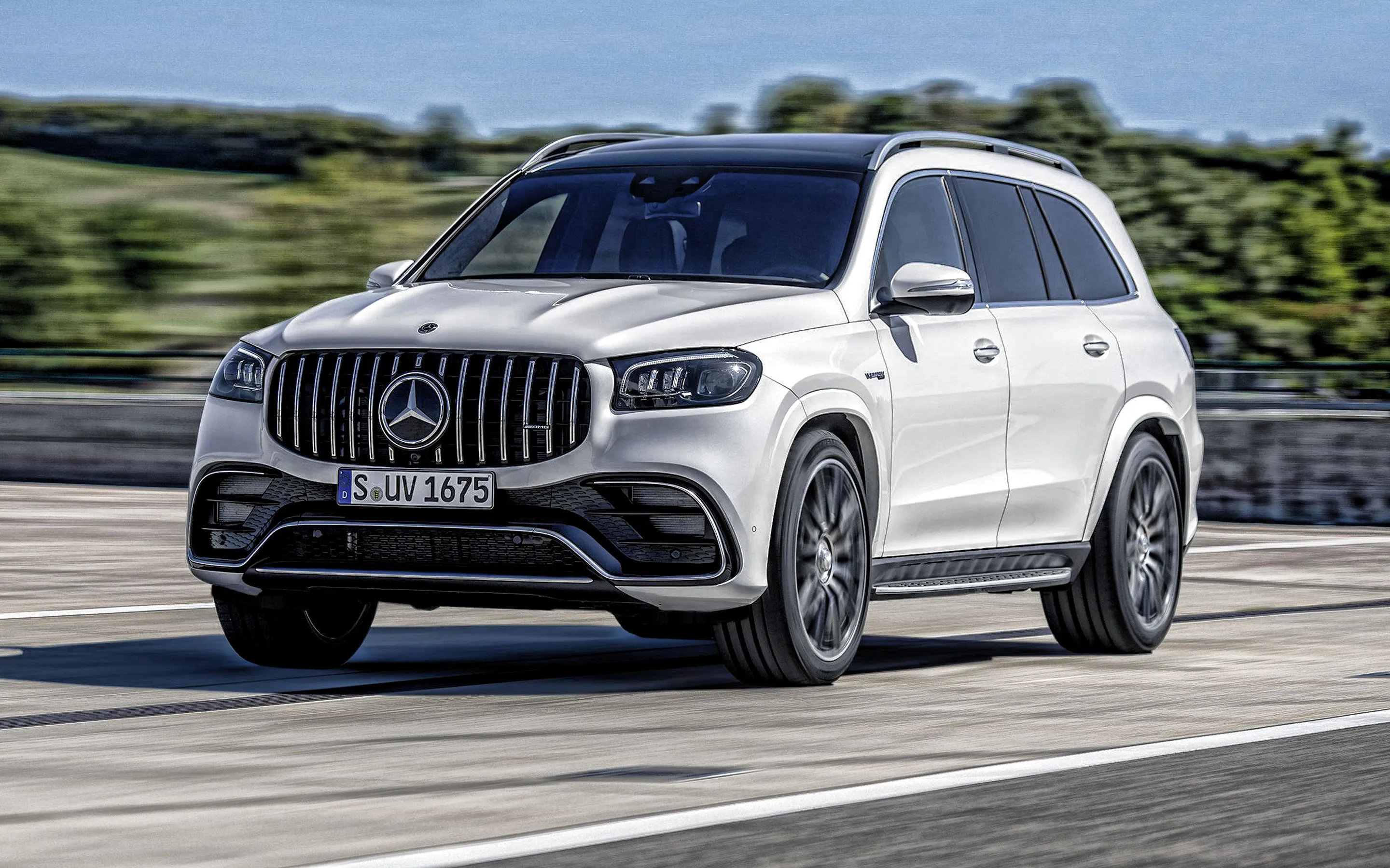 White Mercedes Benz SUV Driving on Forest Road image