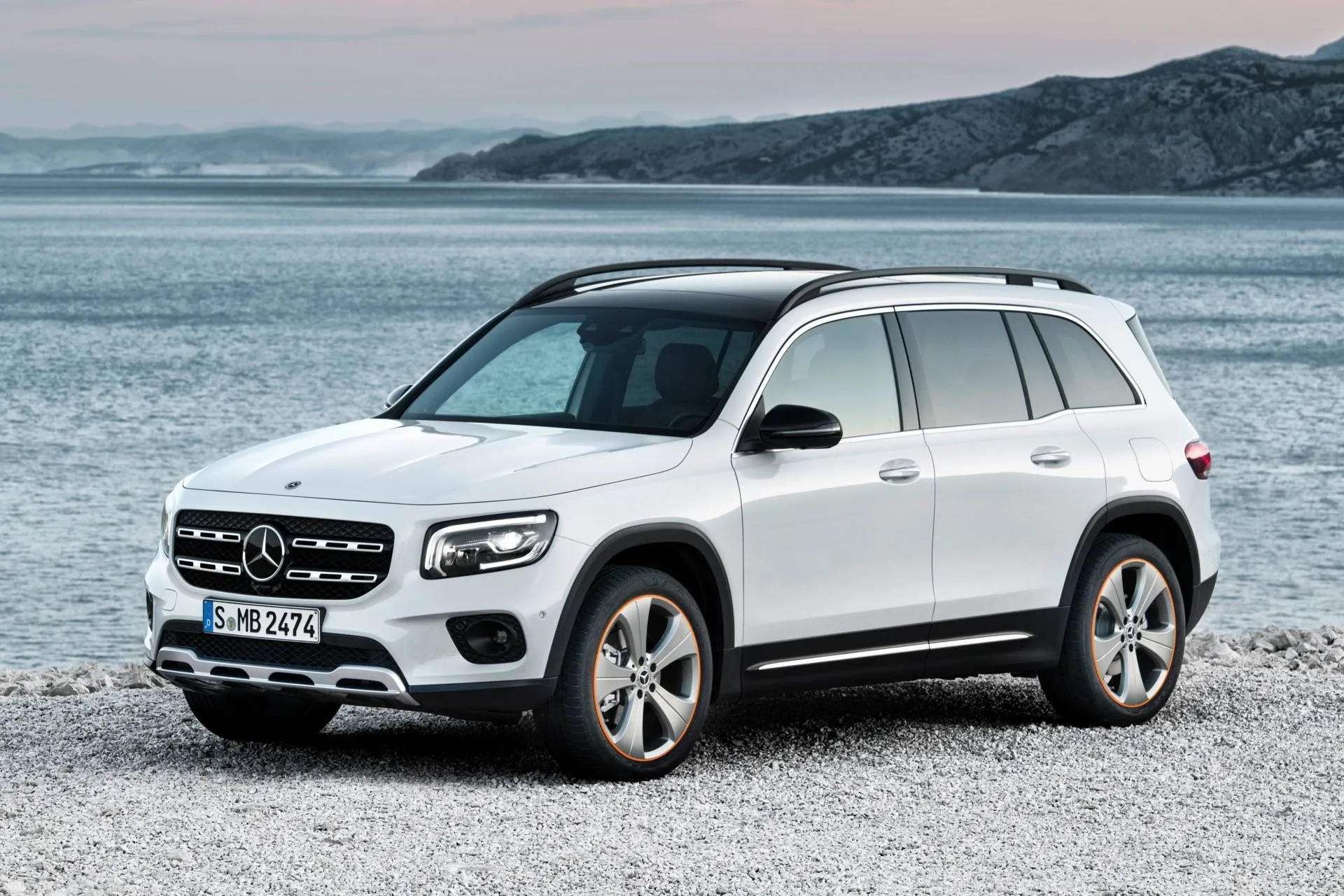 White Mercedes Benz SUV Parked on a Beachside Road Wallpaper