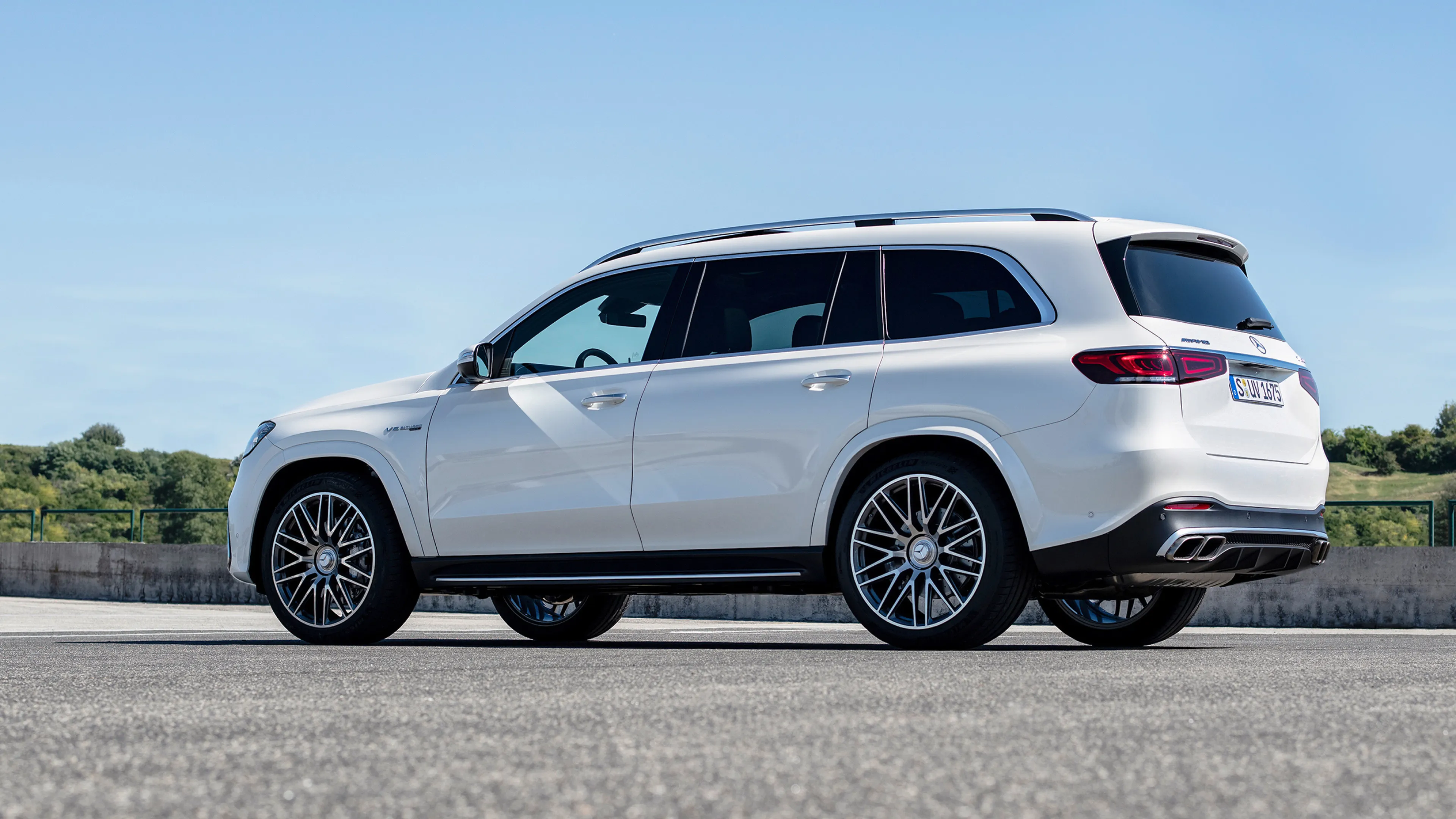 White Mercedes Benz SUV Parked on Open Roadside image