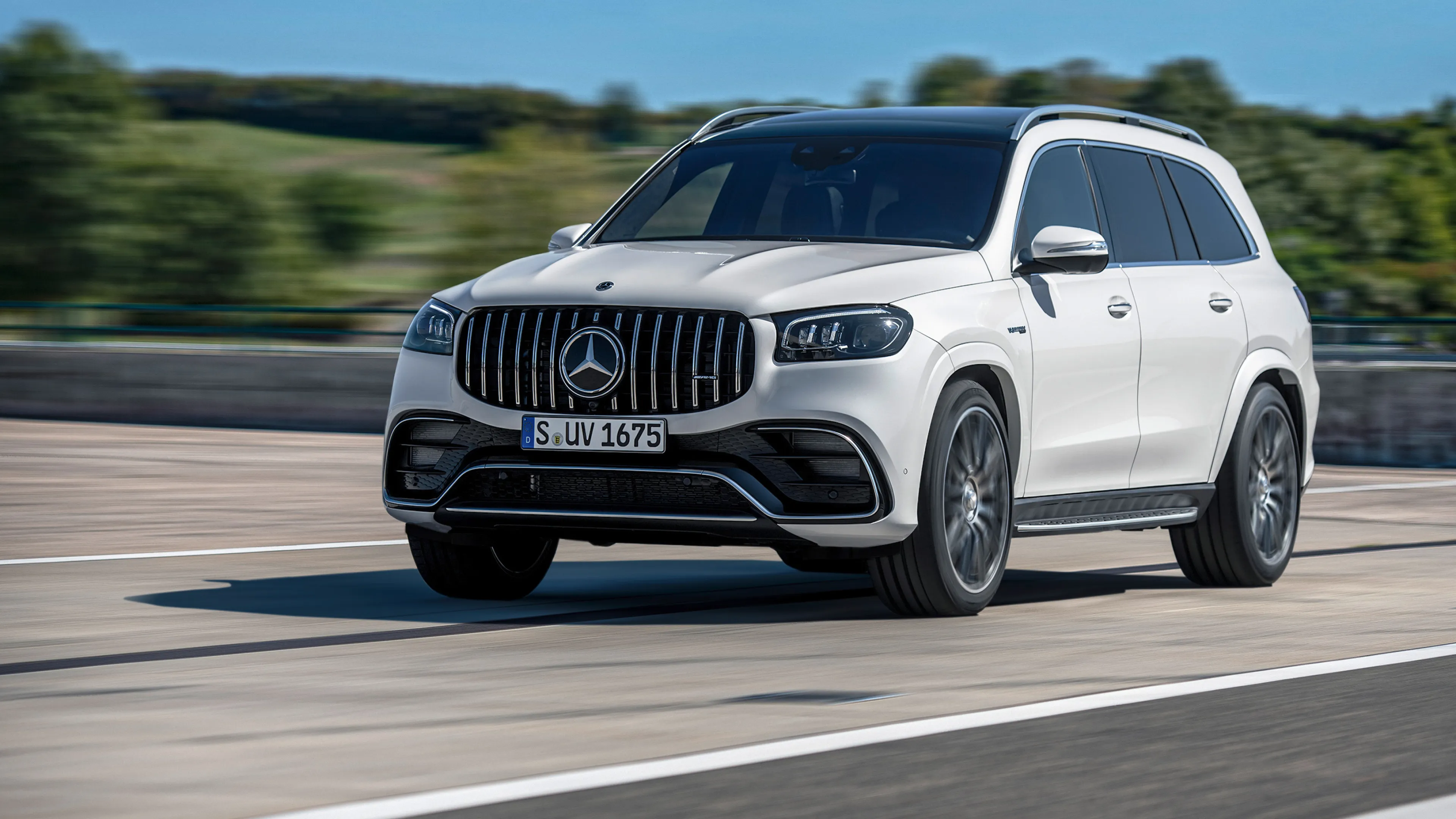 White Mercedes Benz SUV Speeding on a City Road Wallpaper
