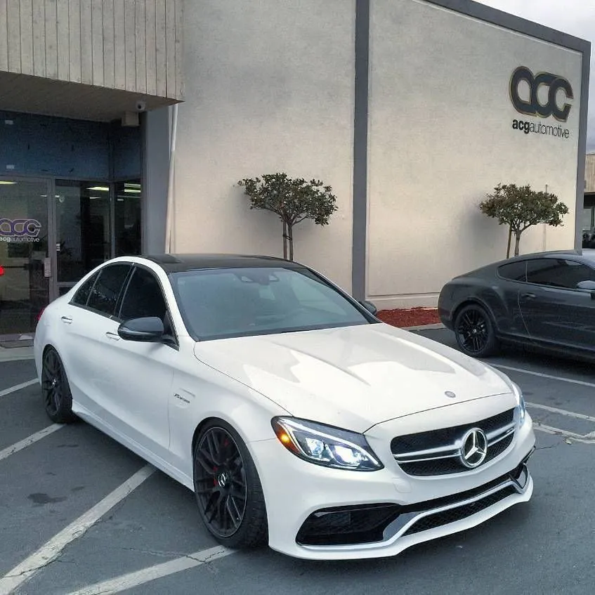 White Mercedes C Class Coupe Parked Outside Auto Center