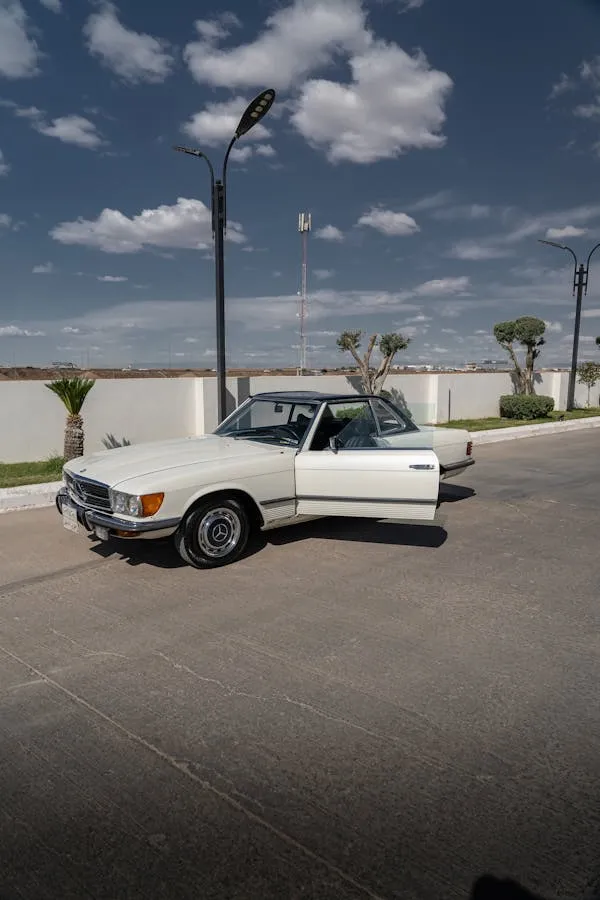 White Mercedes car parked on sunny open road Wallpaper 4K
