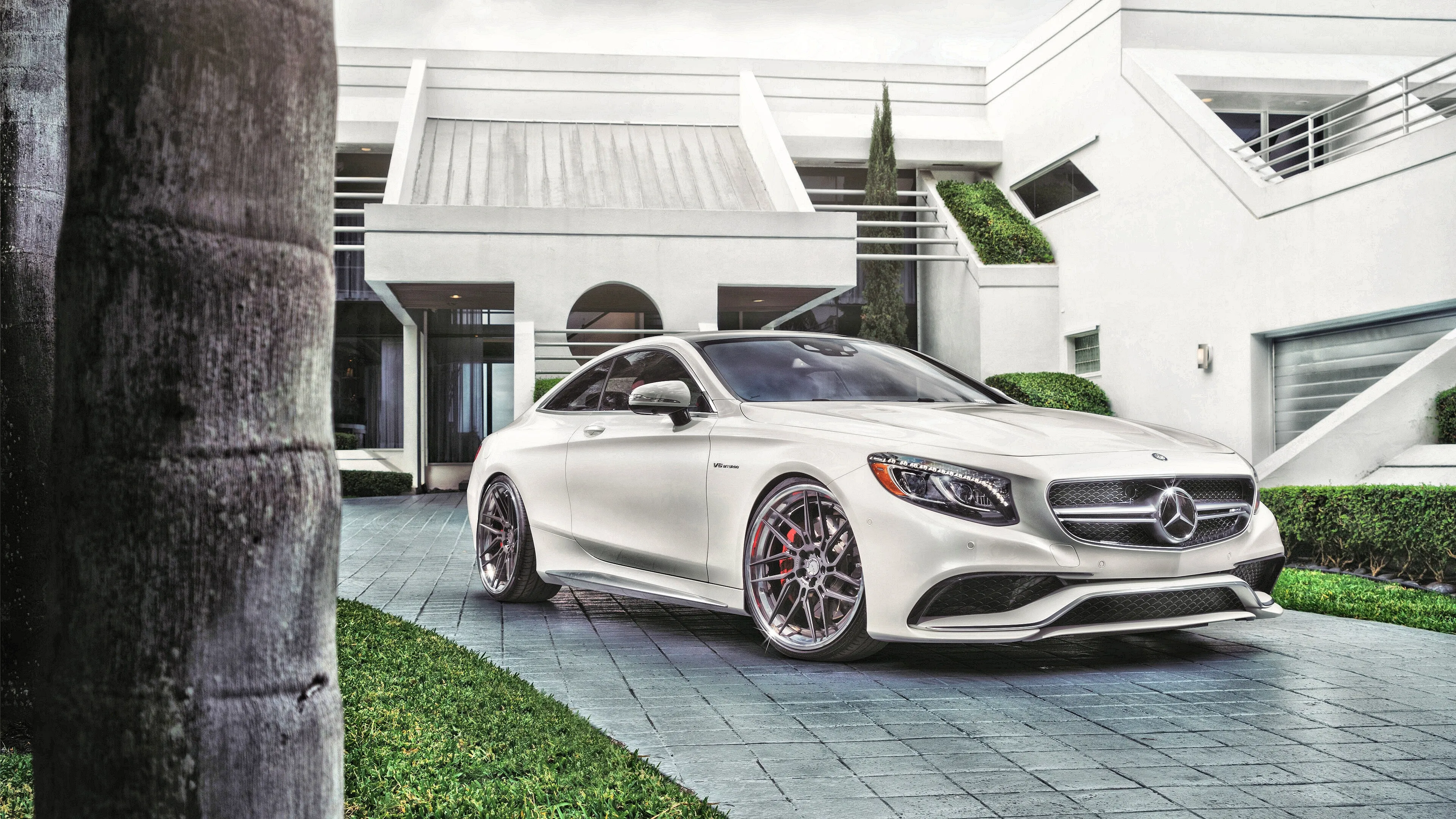 White Mercedes Convertible Parked at Luxury Mansion image