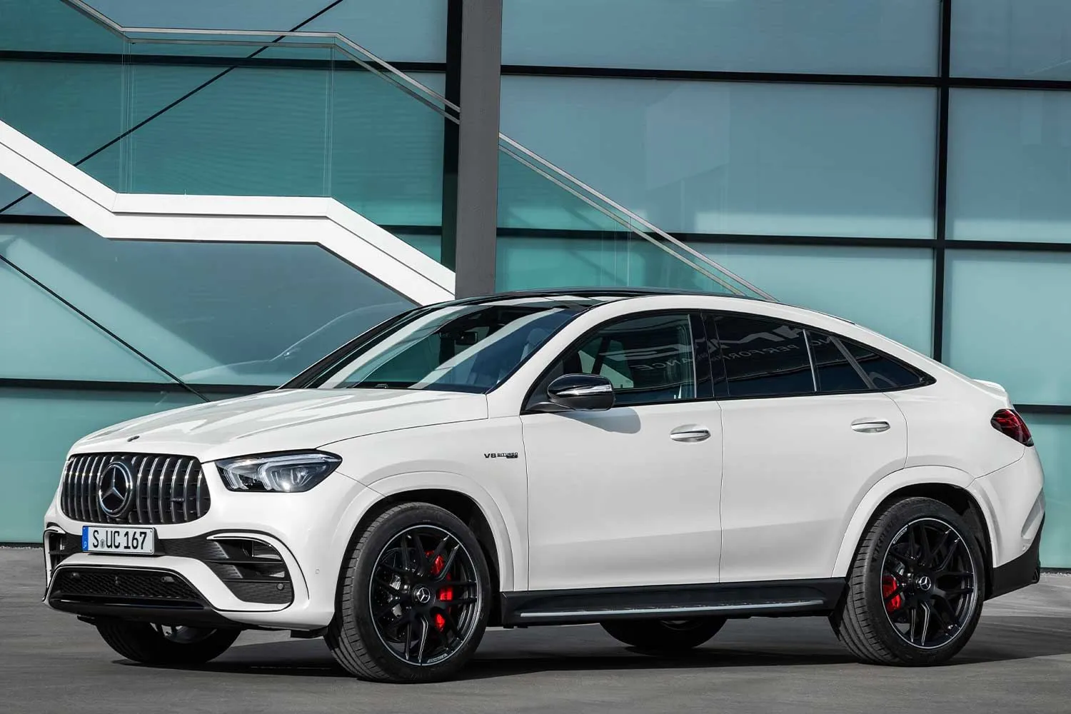 White Mercedes Coupe SUV Near Modern Building Wallpaper