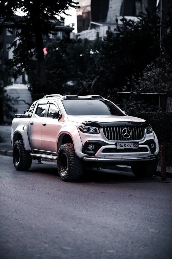 White Mercedes Pickup Truck Parked on City Street Wallpapeer