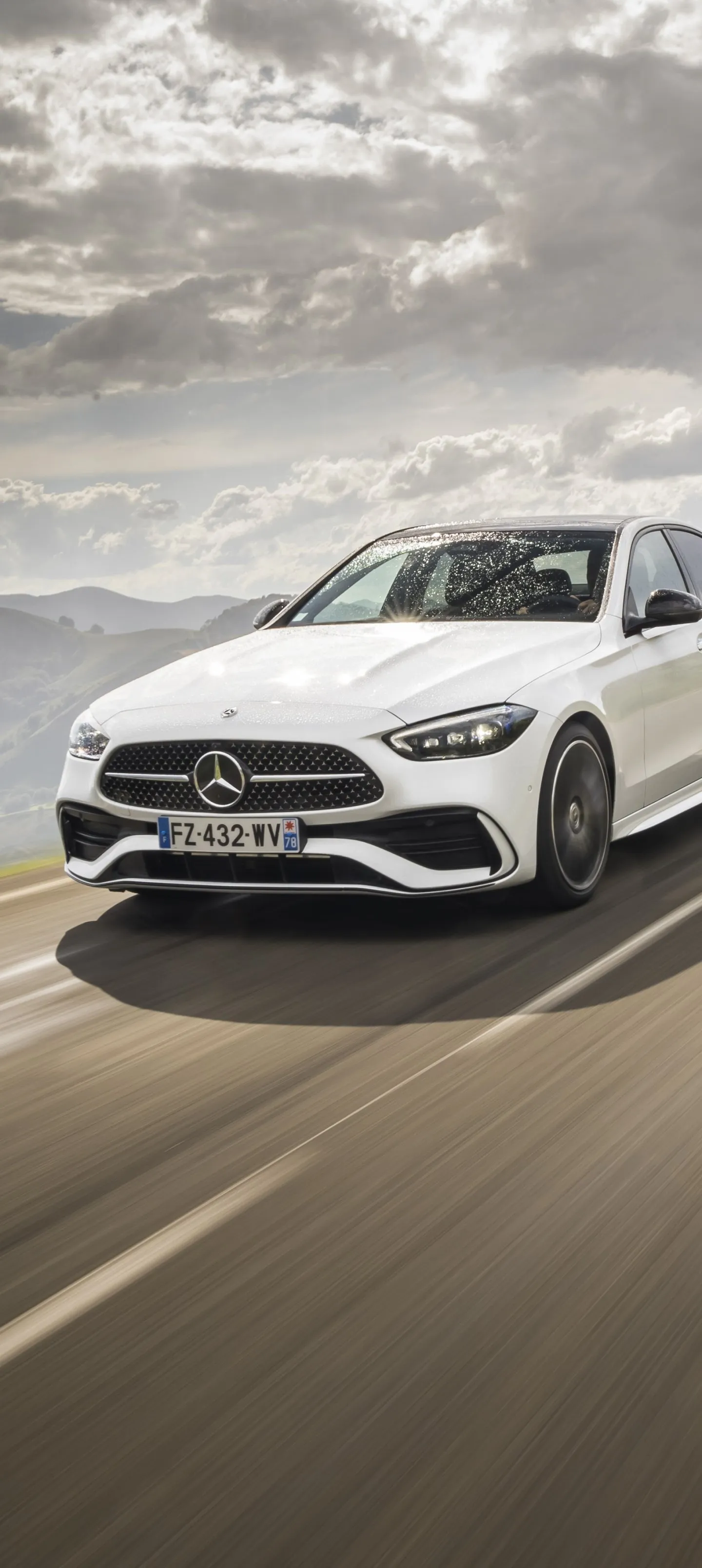 White Mercedes Sedan Driving Fast on Dusty Road Wallpaper