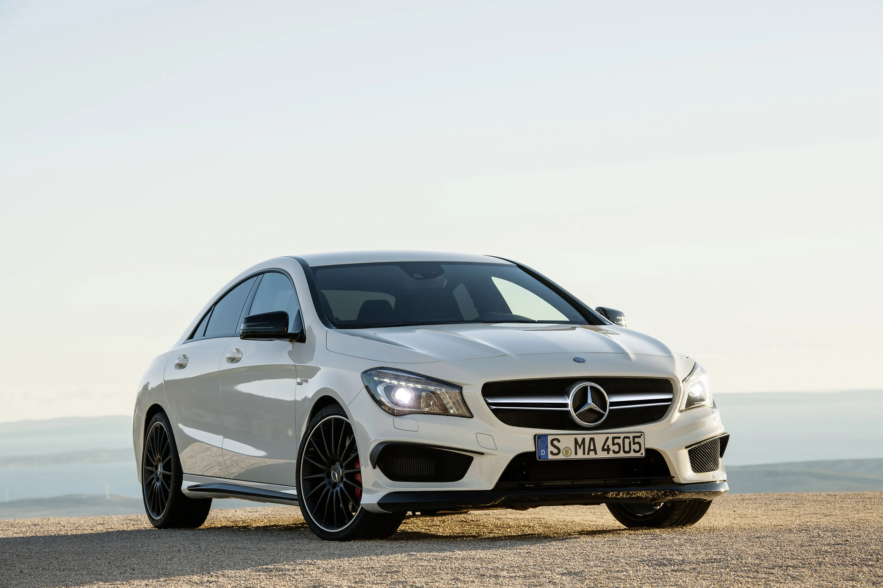 White Mercedes Sedan with Sport Package Details Wallpaper