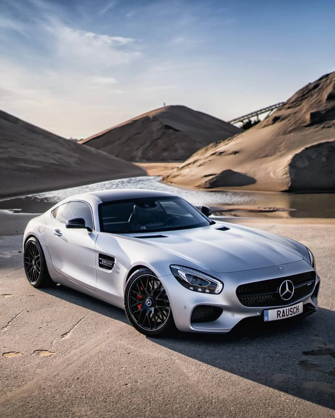 White Mercedes Sports Car Parked in Sandy Hills Area