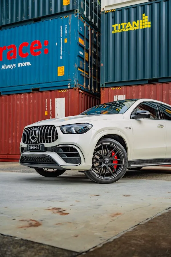 White Mercedes SUV Parked at Shipping Yard Zone Wallpaper