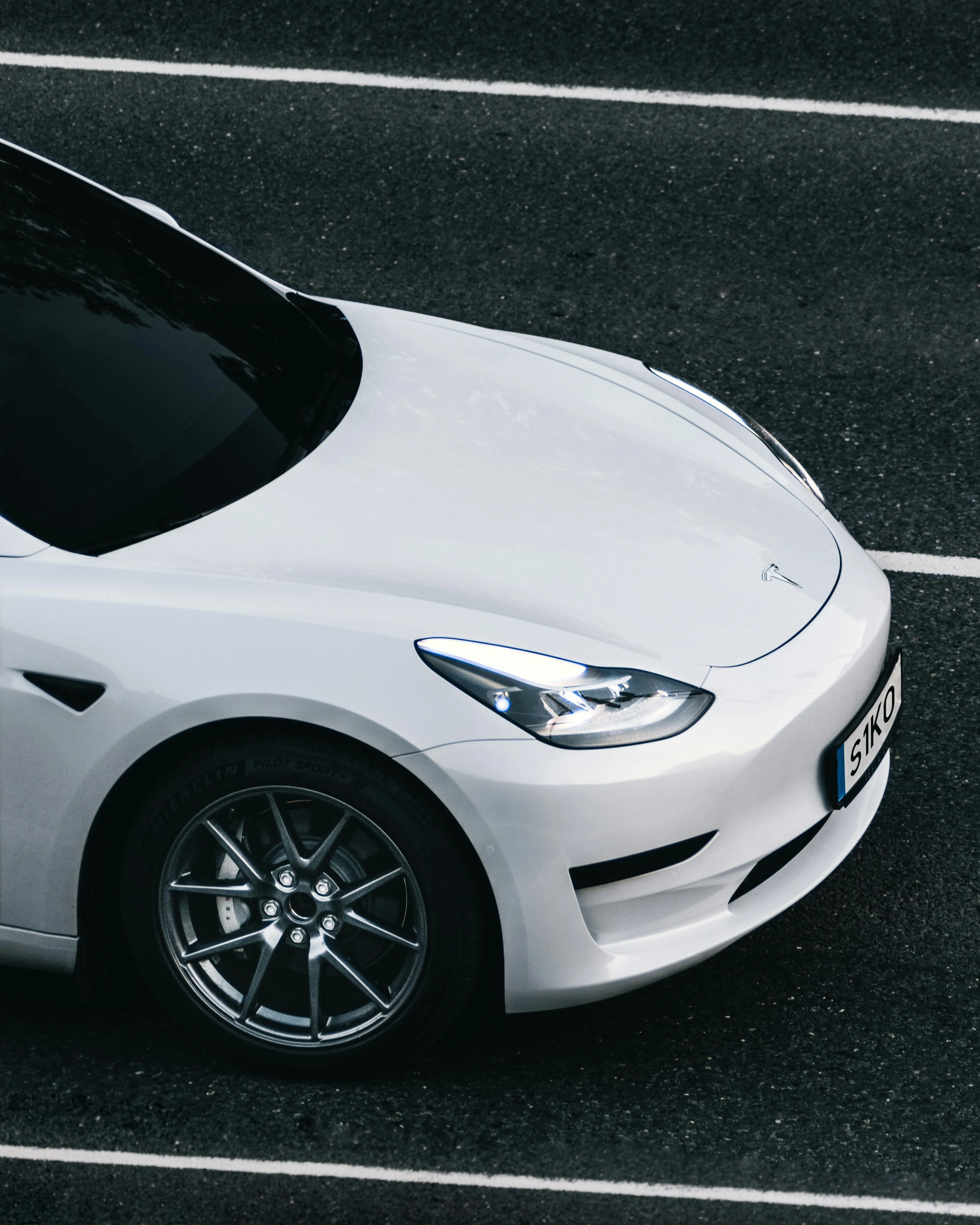 White Tesla 3 Close Up Shot of Front and Side View HD image