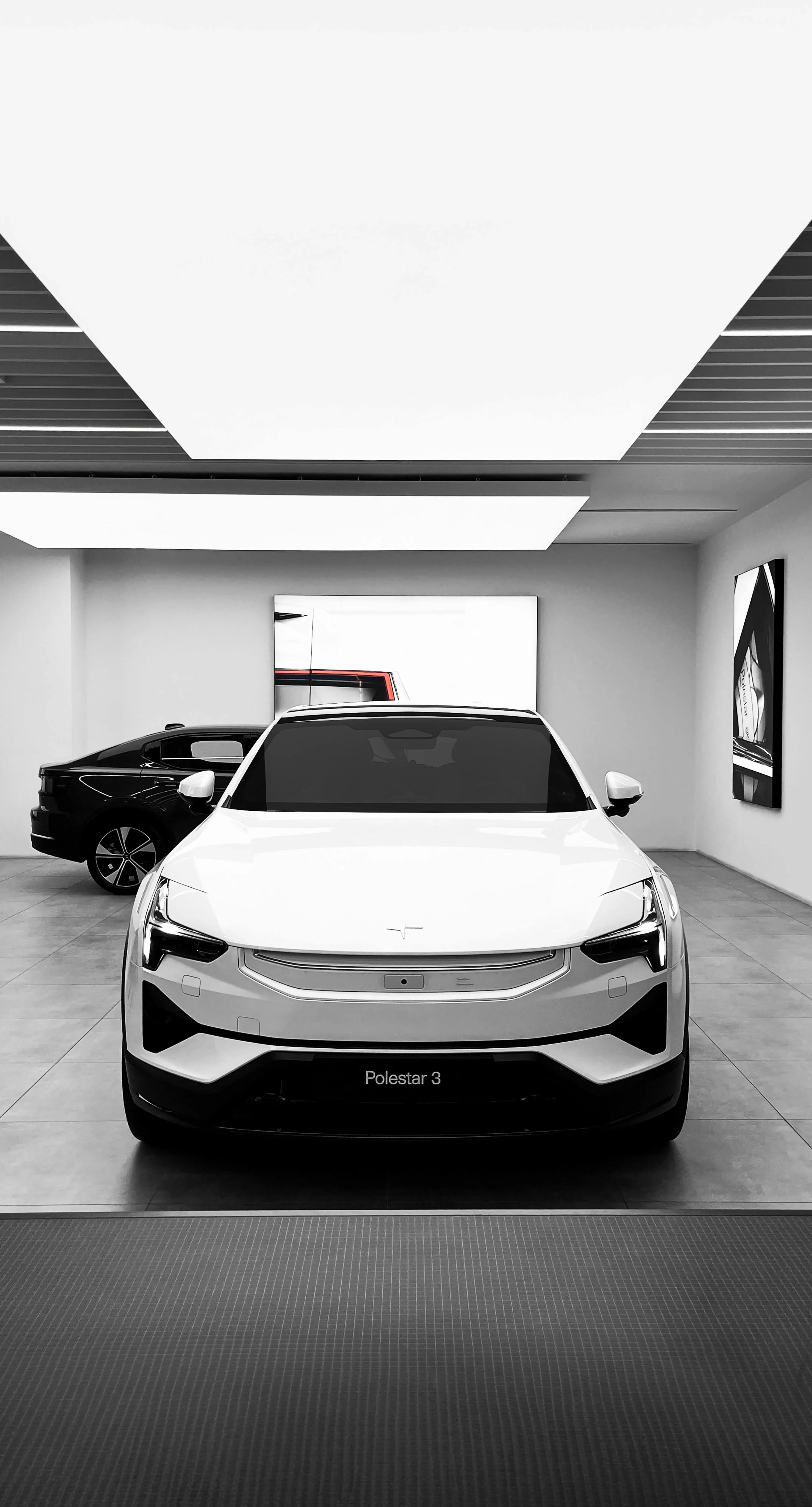 White Tesla Model Y in showroom HD wallpaper image for phone