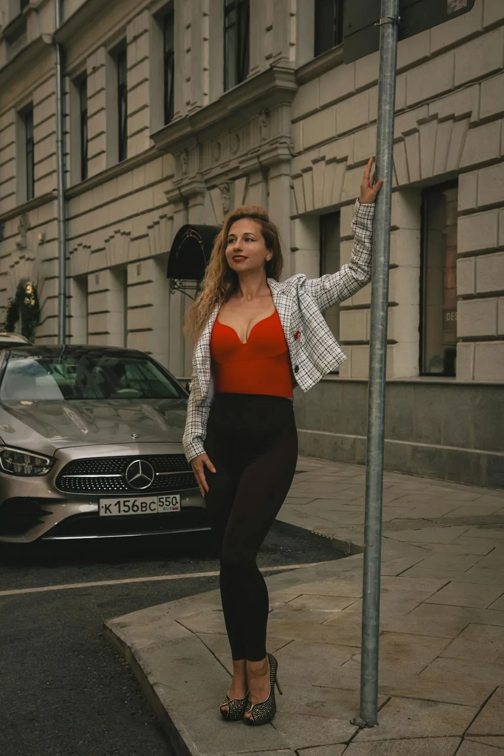 Woman Standing Beside Mercedes in City Street Wallpaper