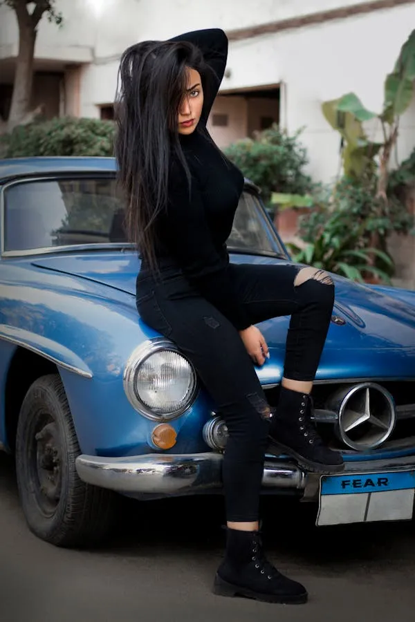 Women Sitting on Hood of Classic Blue Mercedes Benz Car