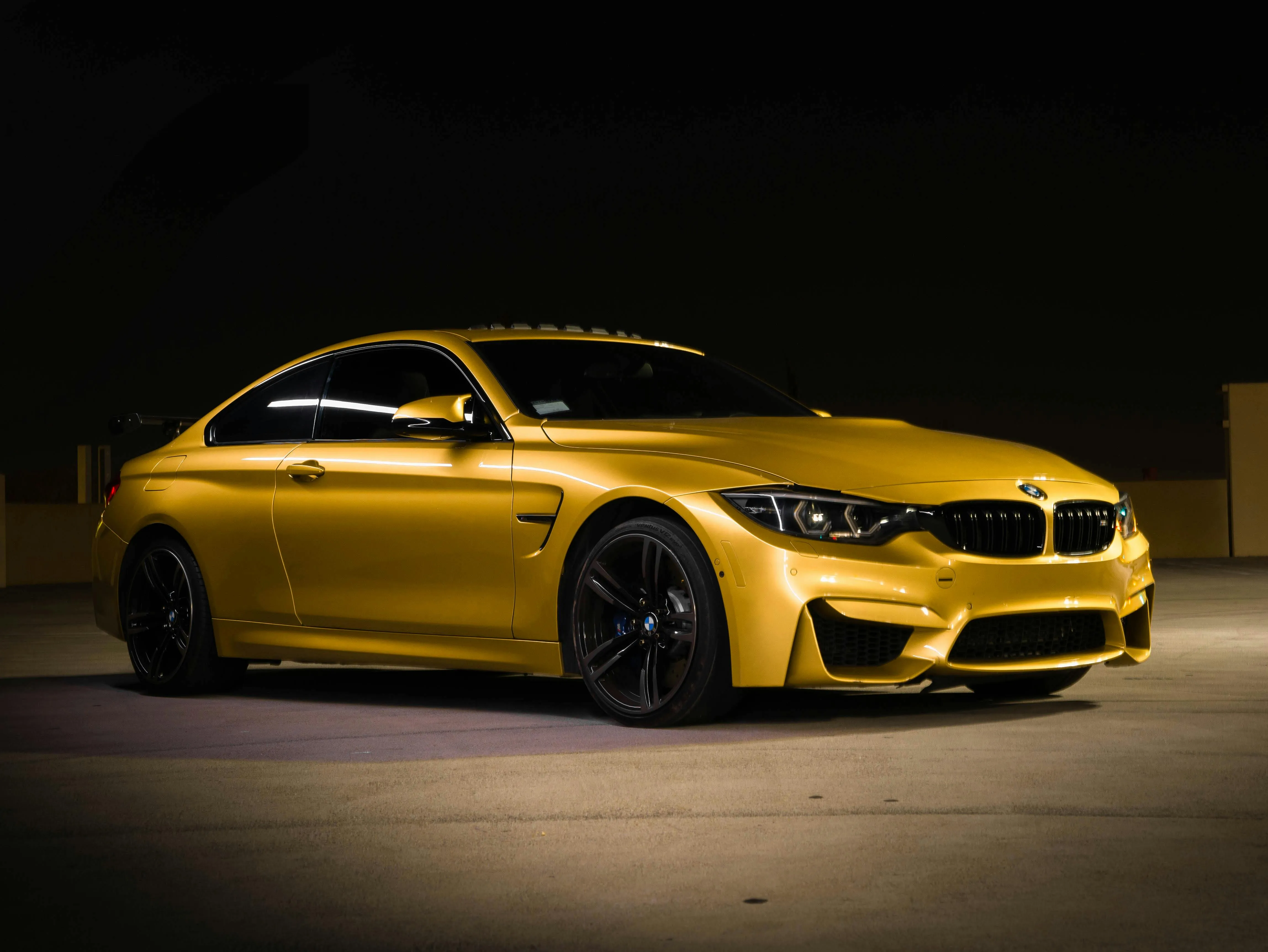 Yellow Bmw Coupe in Dark Studio with Dramatic Lighting