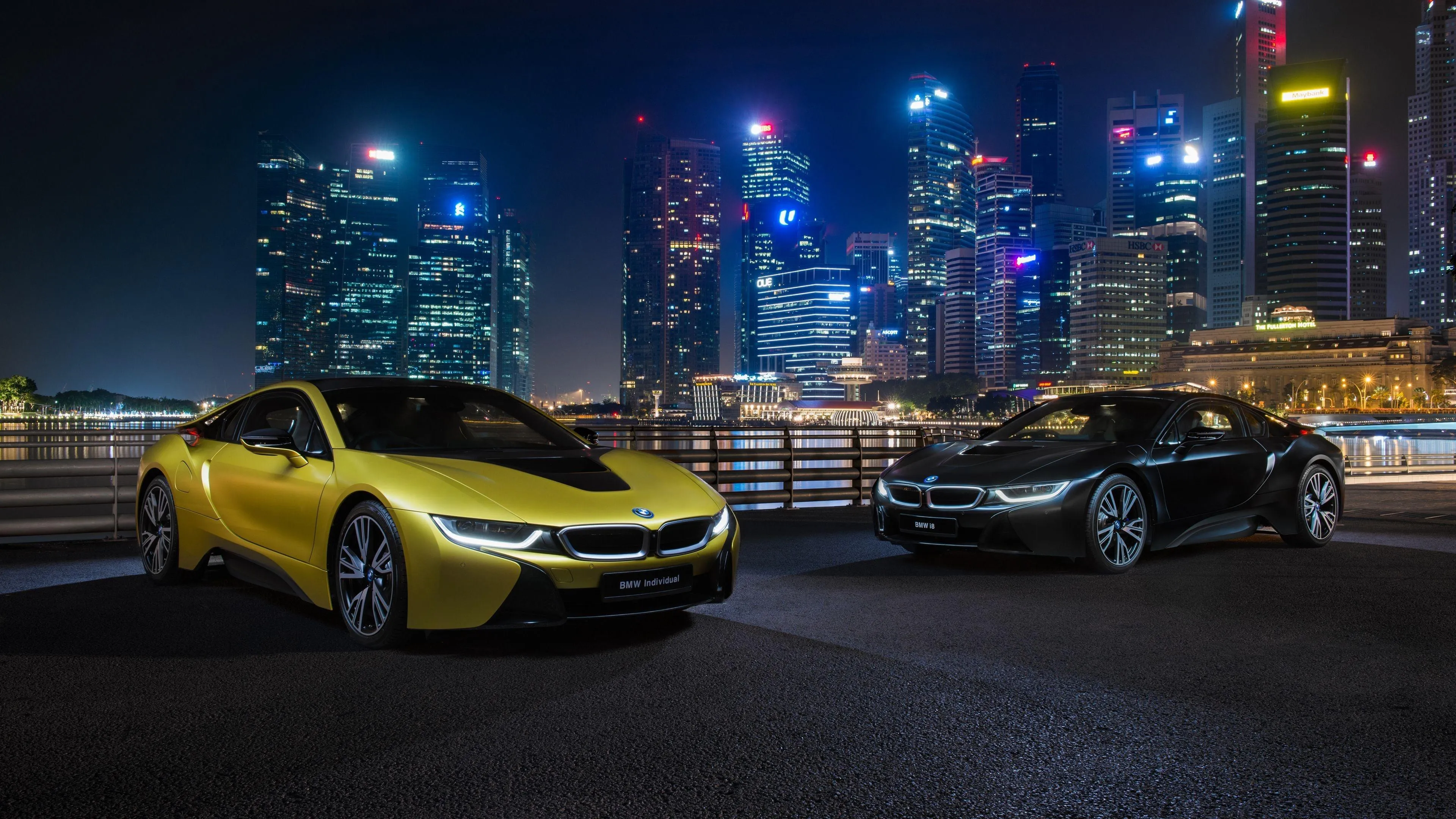 Yellow Bmw Sports Car Parked Under City Lights at Night