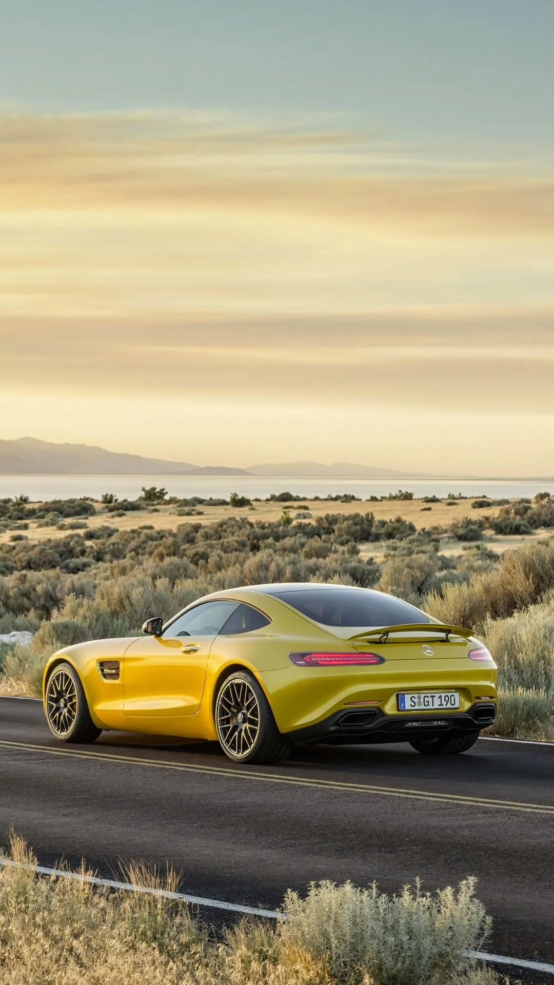 Yellow Mercedes AMG Driving Through Desert free Wallpaper