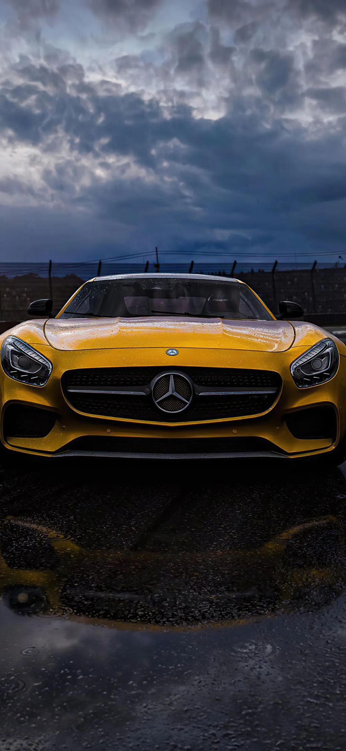 Yellow Mercedes AMG Facing Forward Under Cloudy Skies