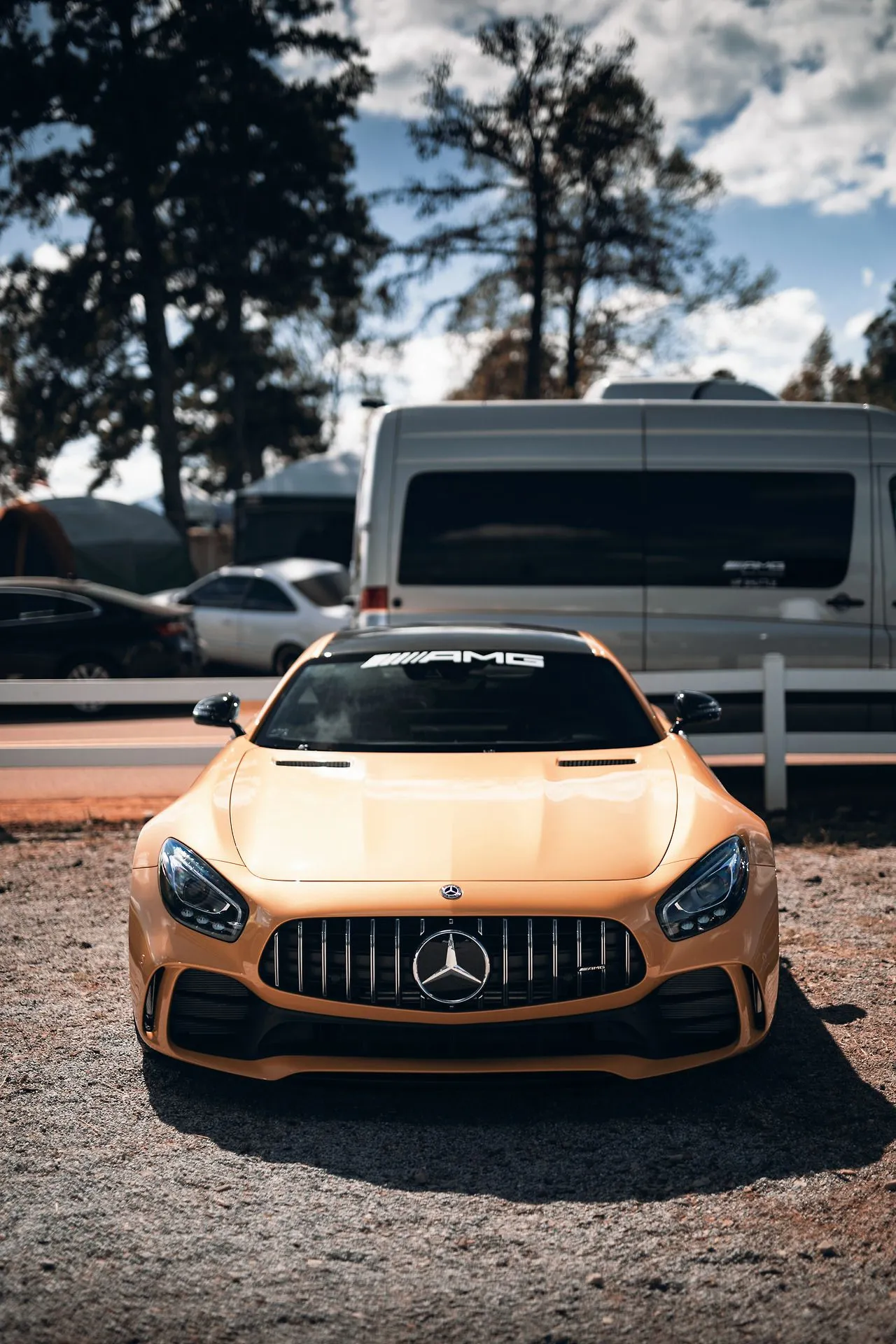 Yellow Mercedes AMG Parked Under Trees Outdoors Wallpaper