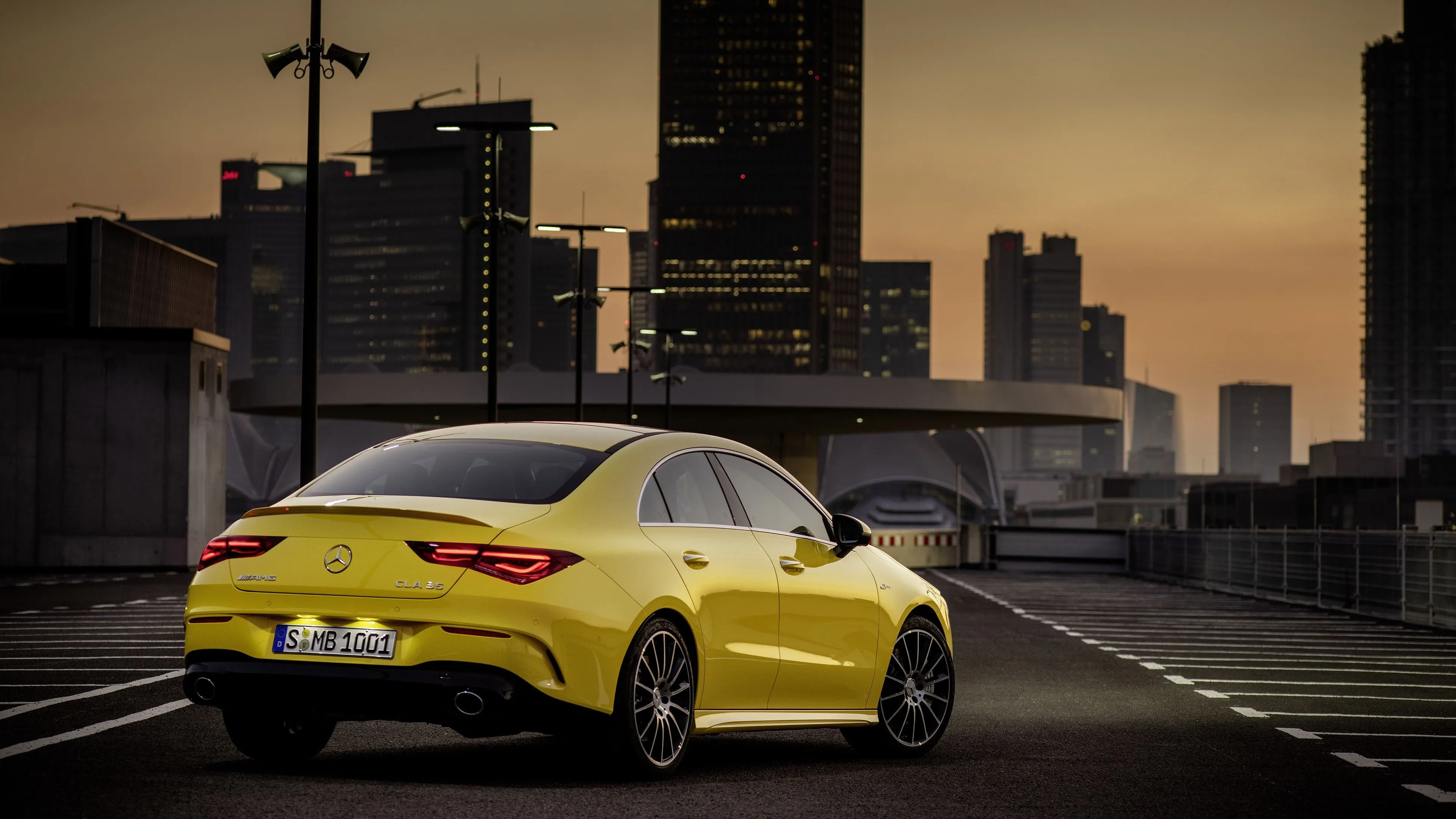 Yellow Mercedes Benz Coupe Parked in City at Sunset image