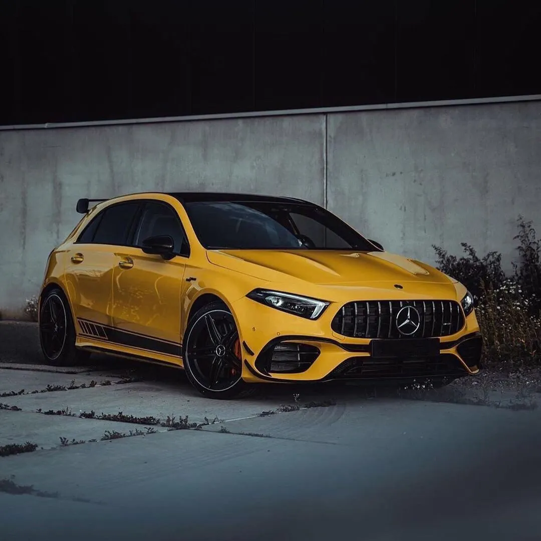 Yellow Mercedes Benz Sports Car Parked in Industrial Area