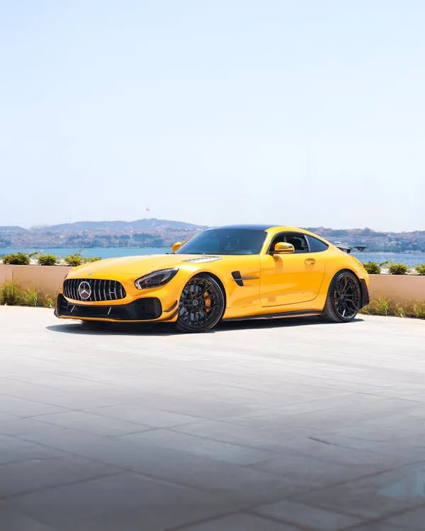 Yellow Mercedes Benz Sports Car Parked in Open Sunny Area