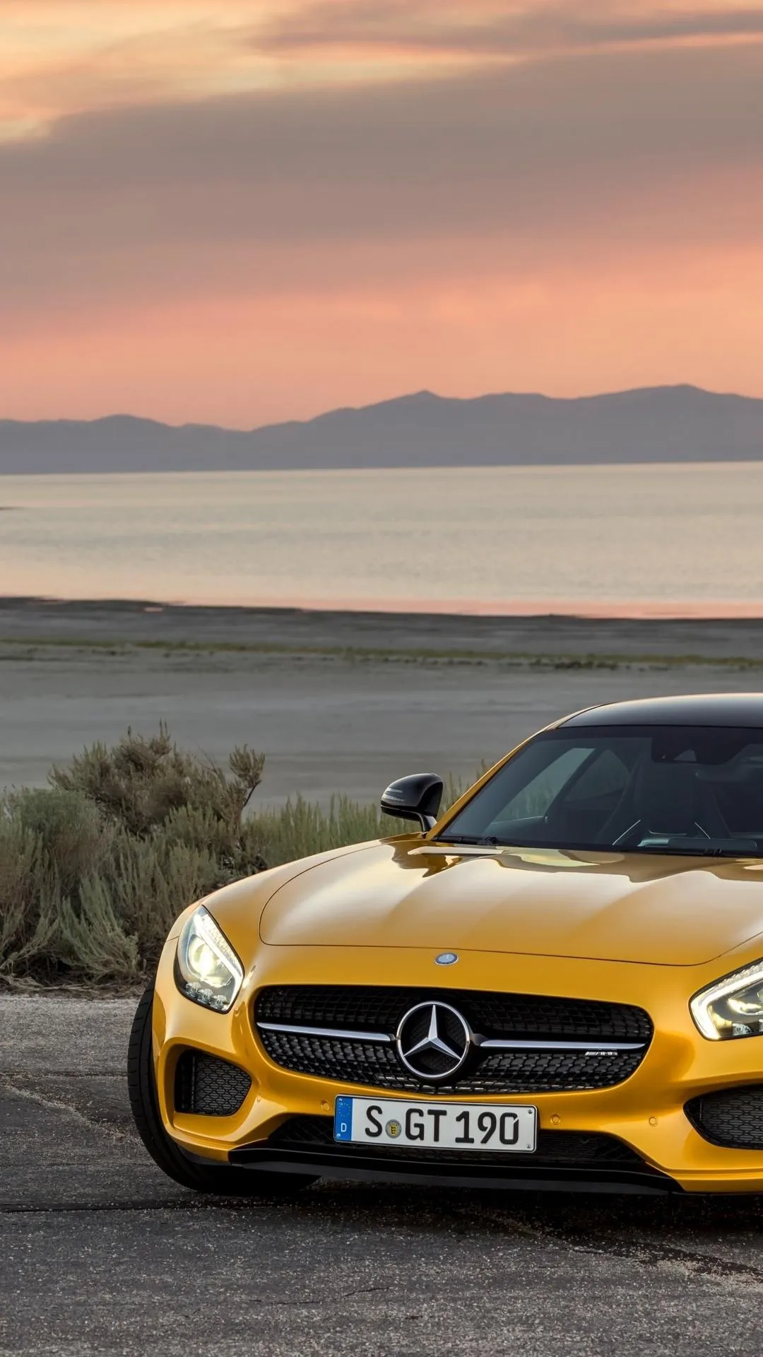 Yellow Mercedes Benz Sports Car Parked Near the Sea