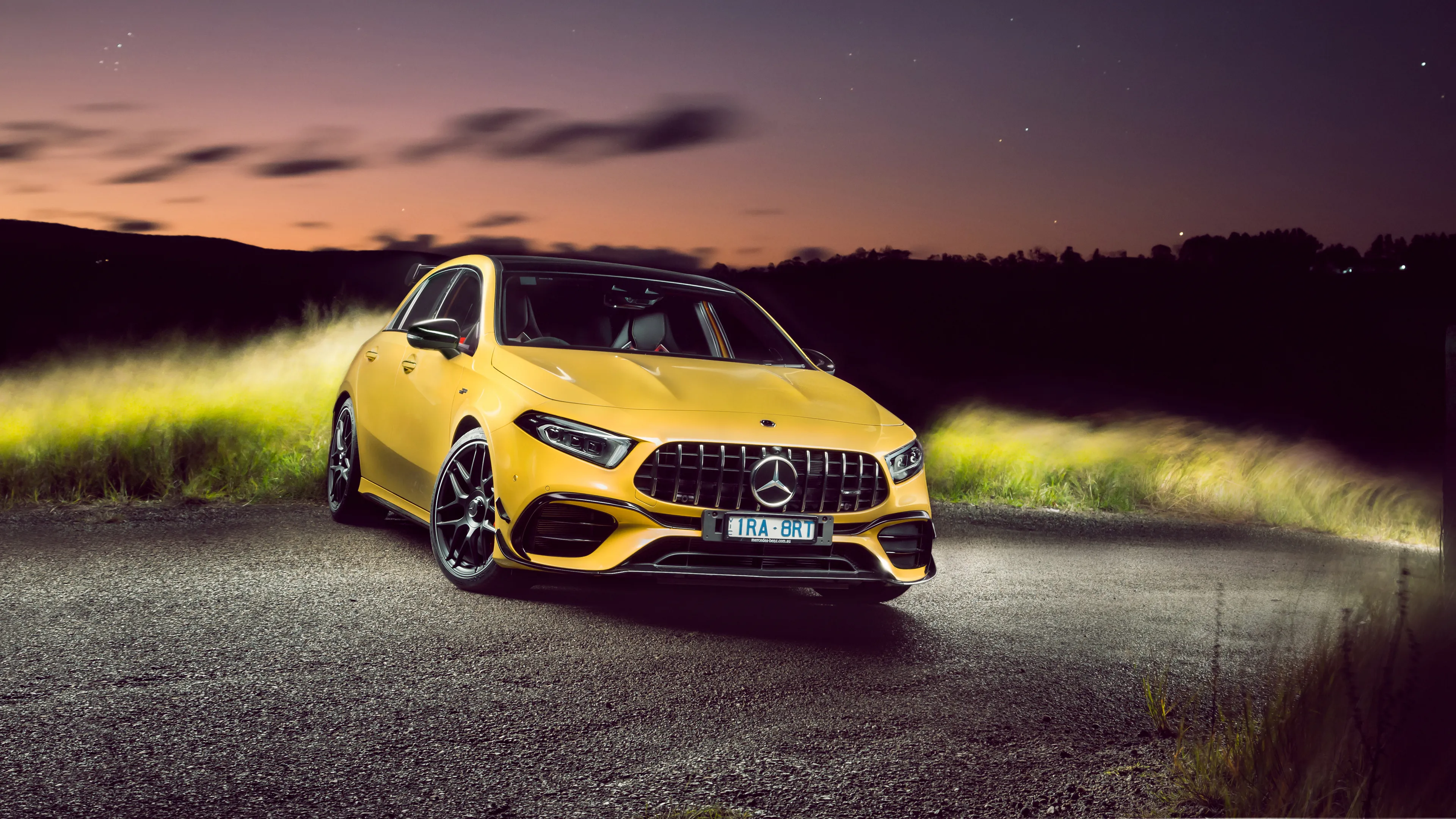 Yellow Mercedes Benz Sporty Car Parked on Night Road image